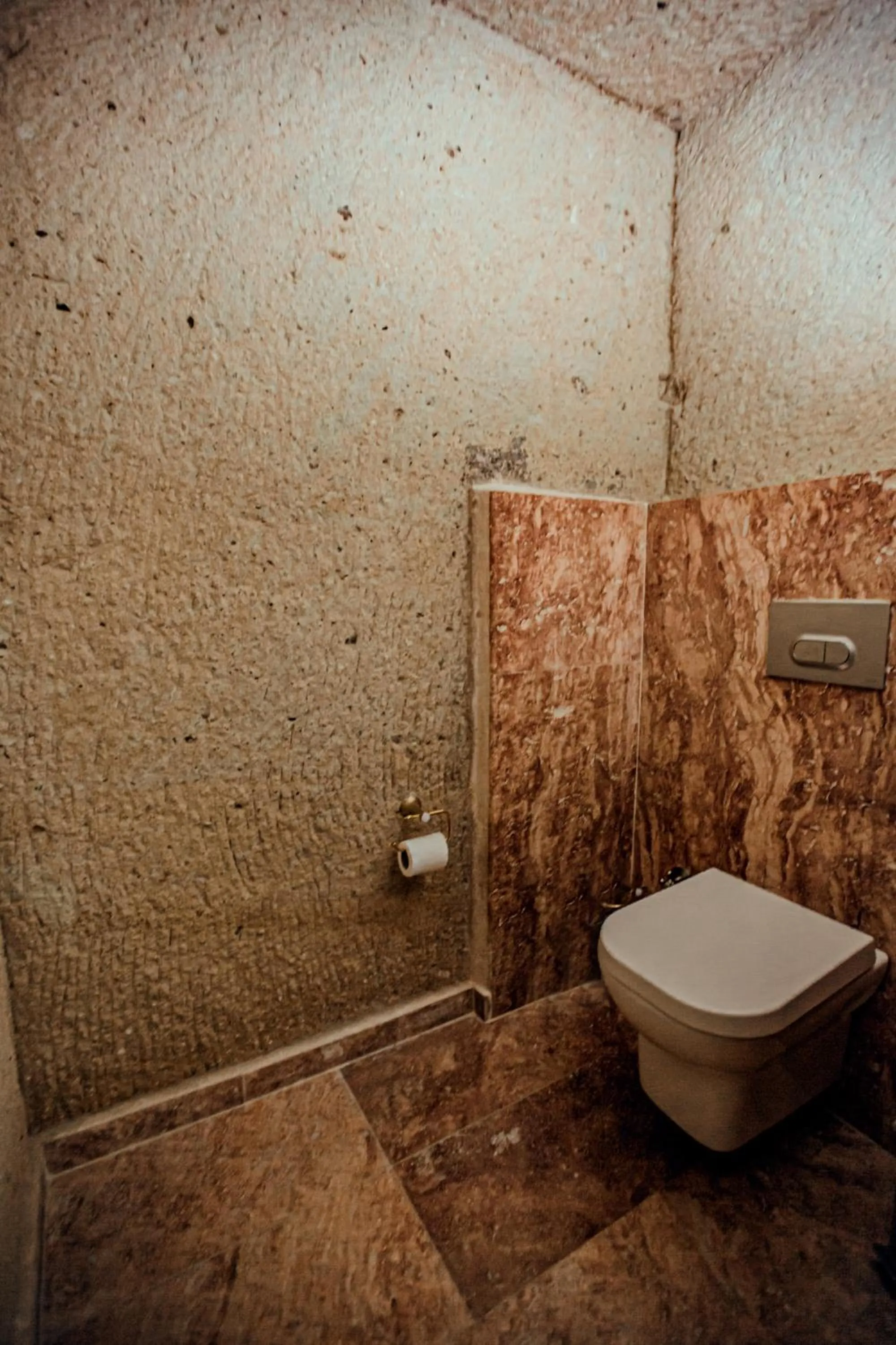 Toilet in Oread Cave Suites