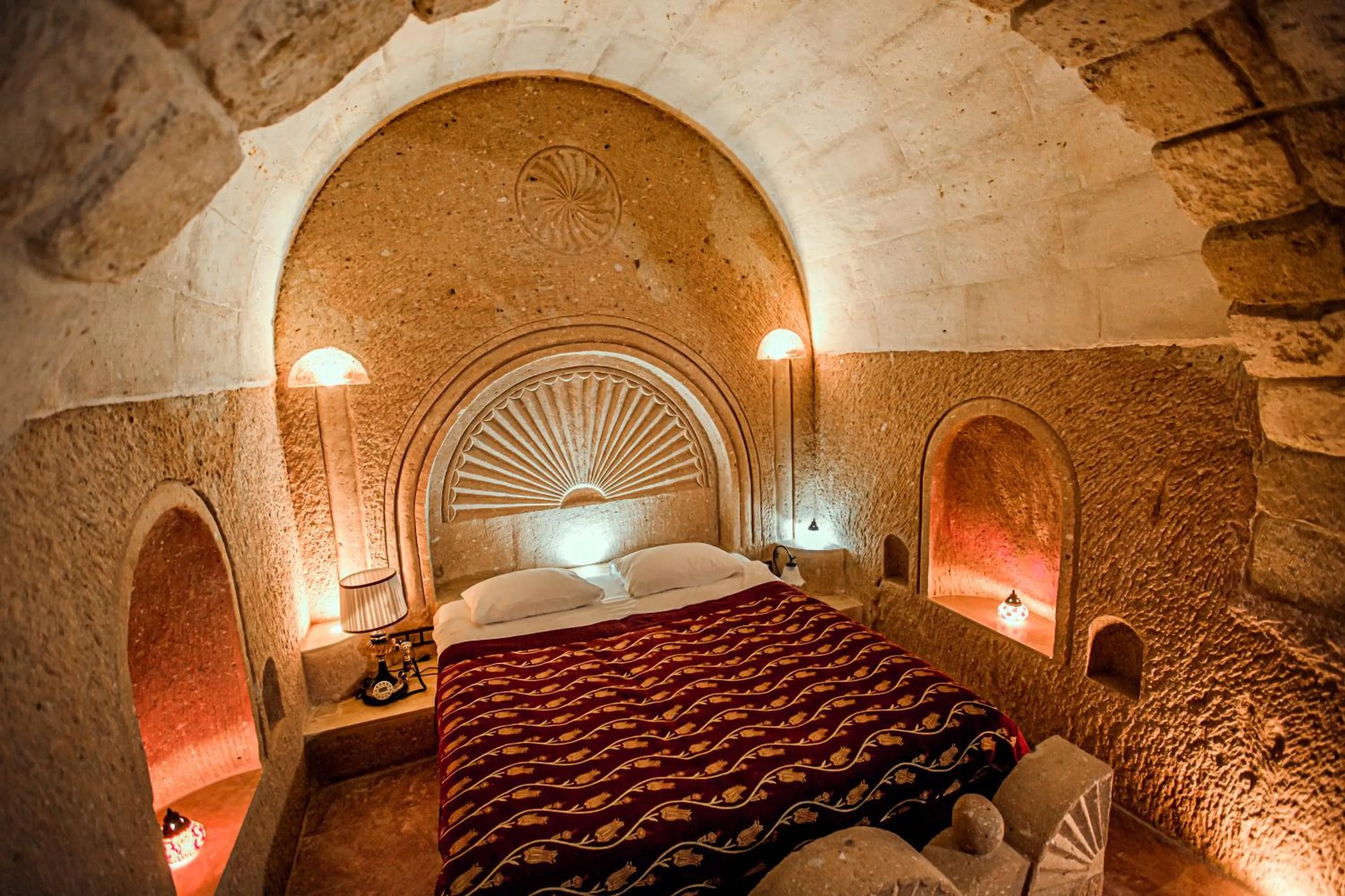 Bed in Oread Cave Suites
