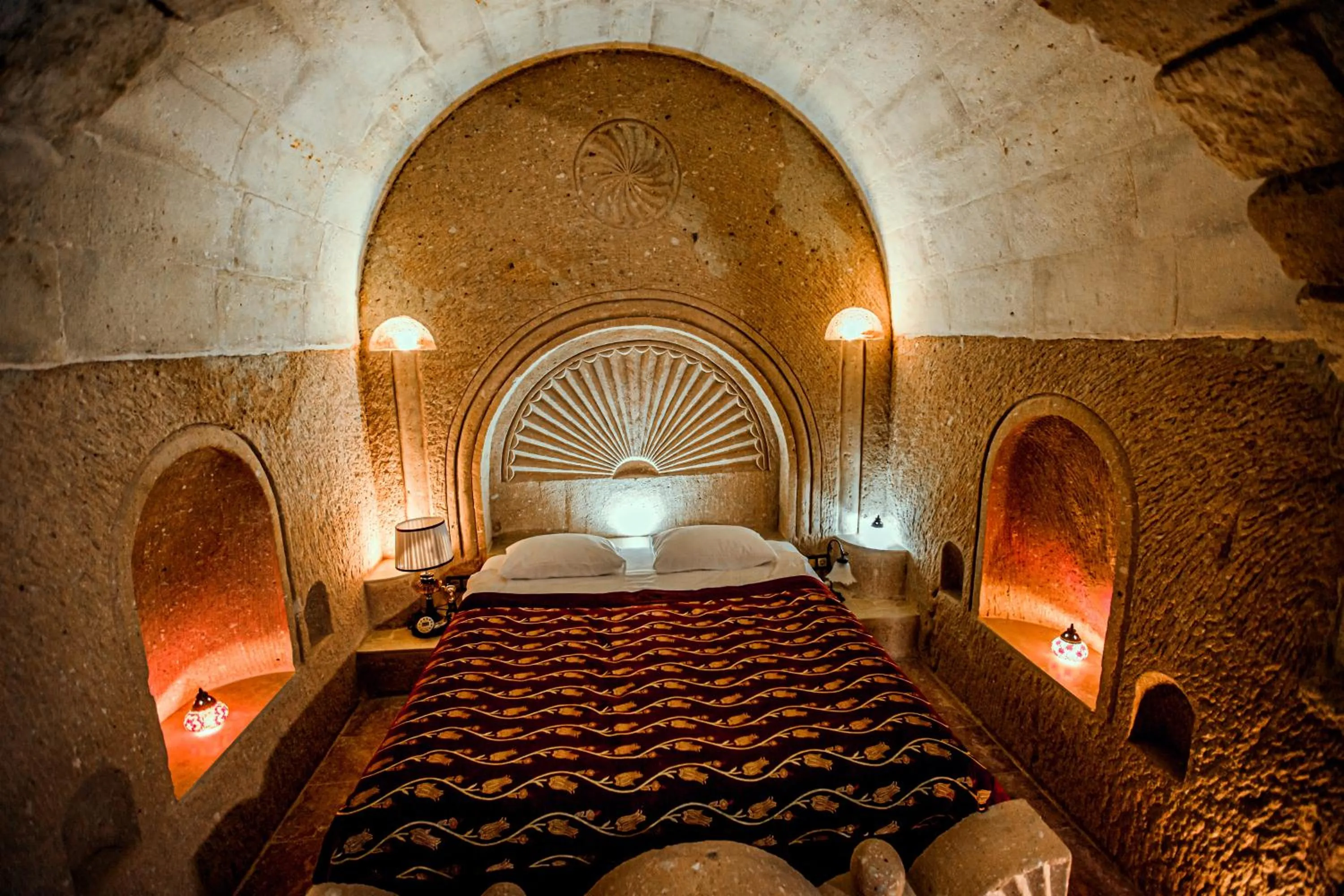 Bed in Oread Cave Suites