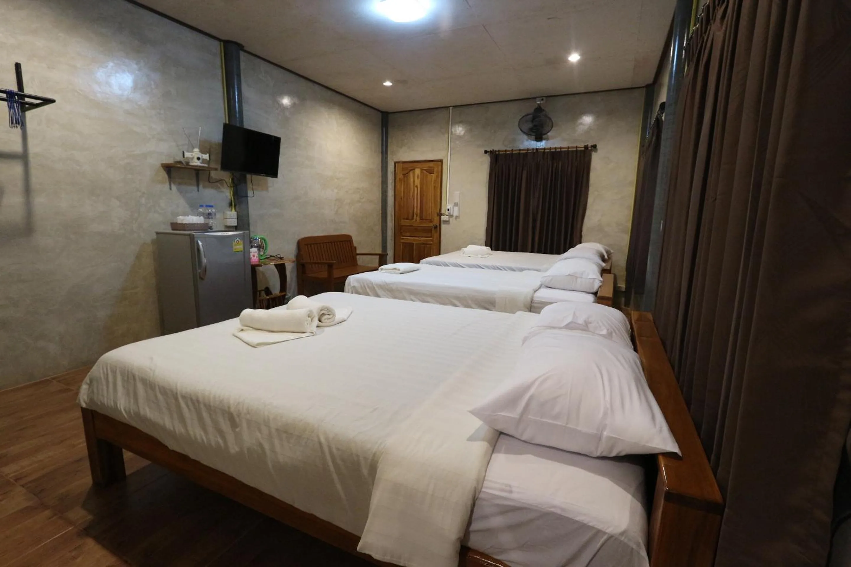 Bed in Baan Khue Wieng Resort