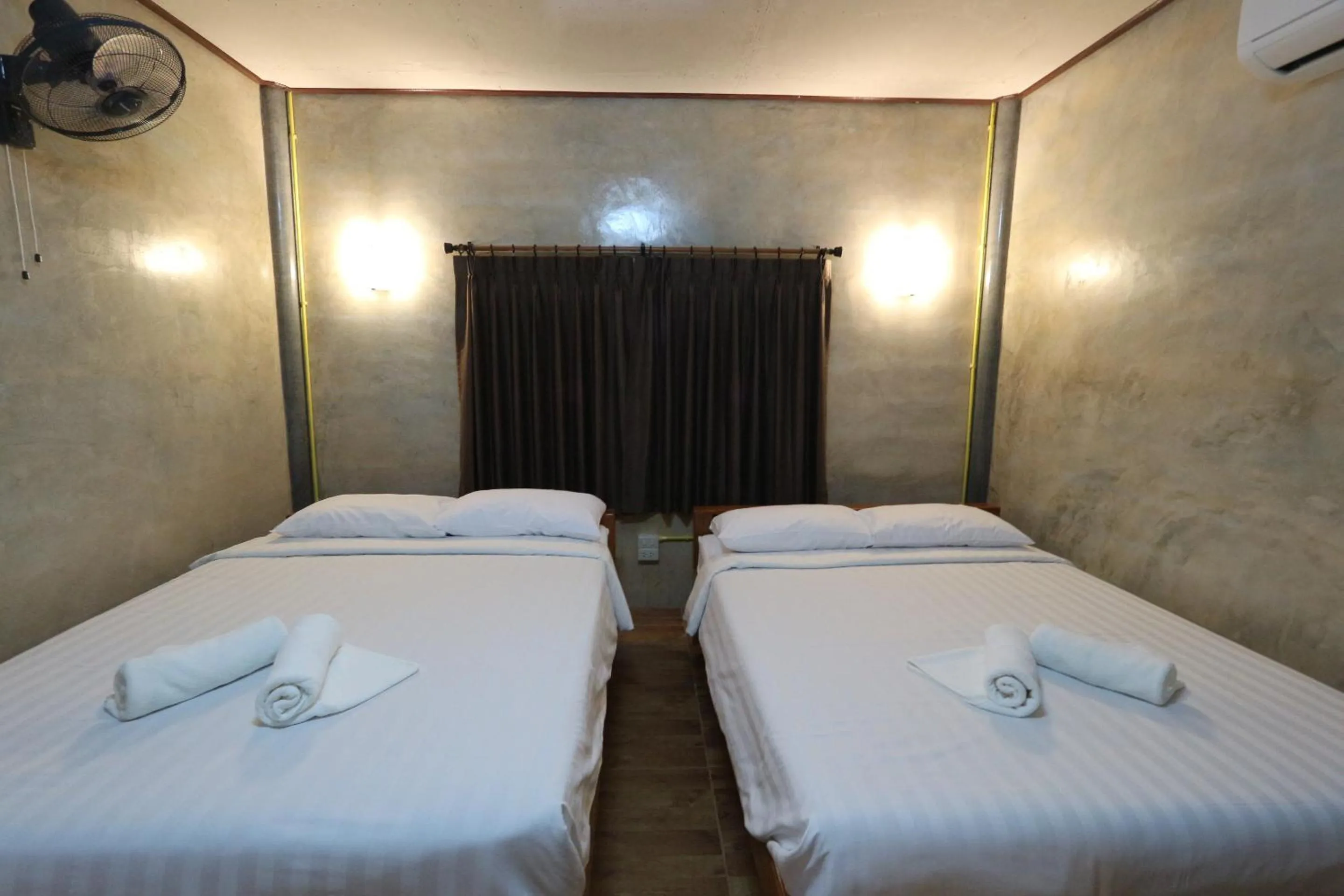 Bed in Baan Khue Wieng Resort