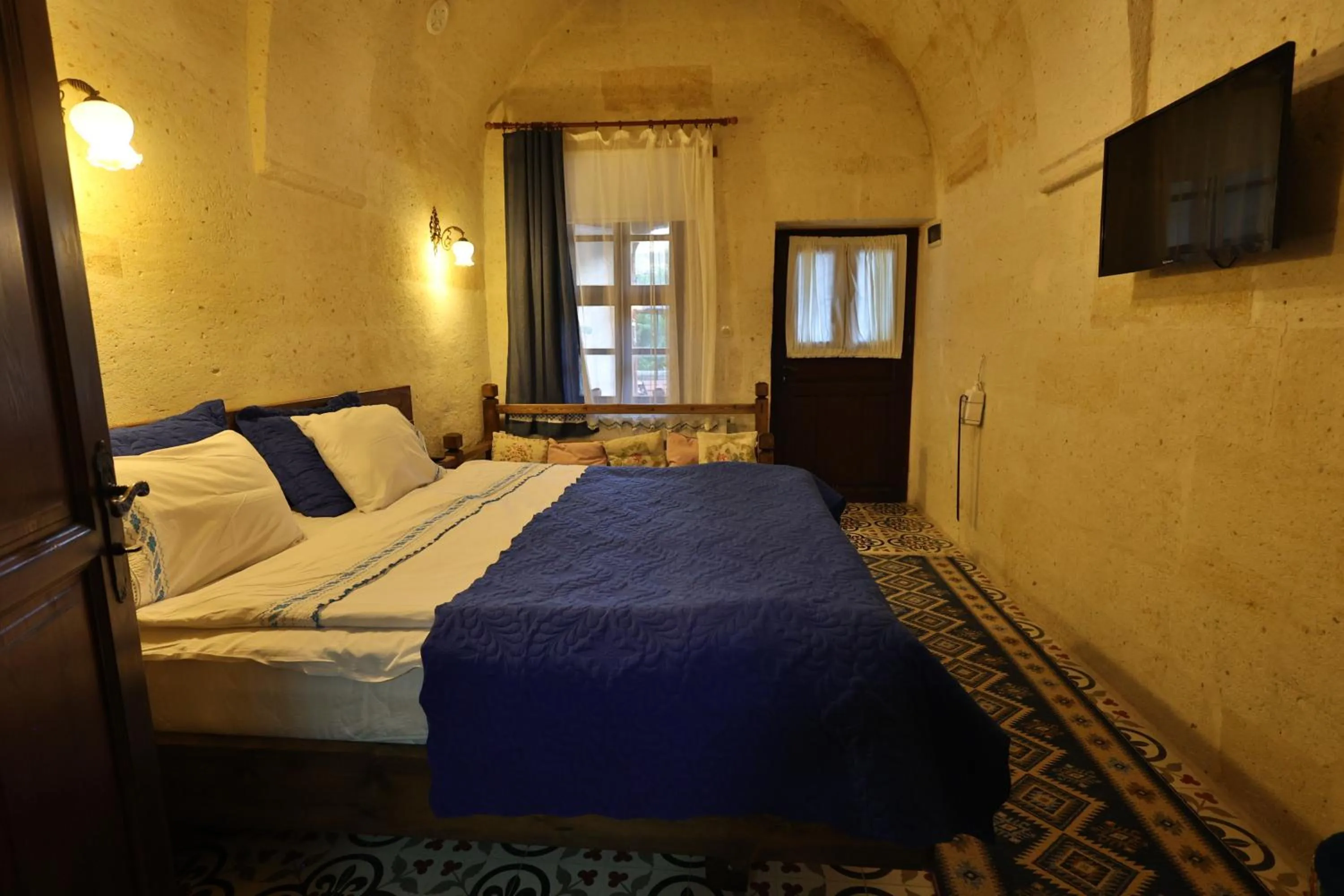 Photo of the whole room, Bed in Demisos Caves Hotel