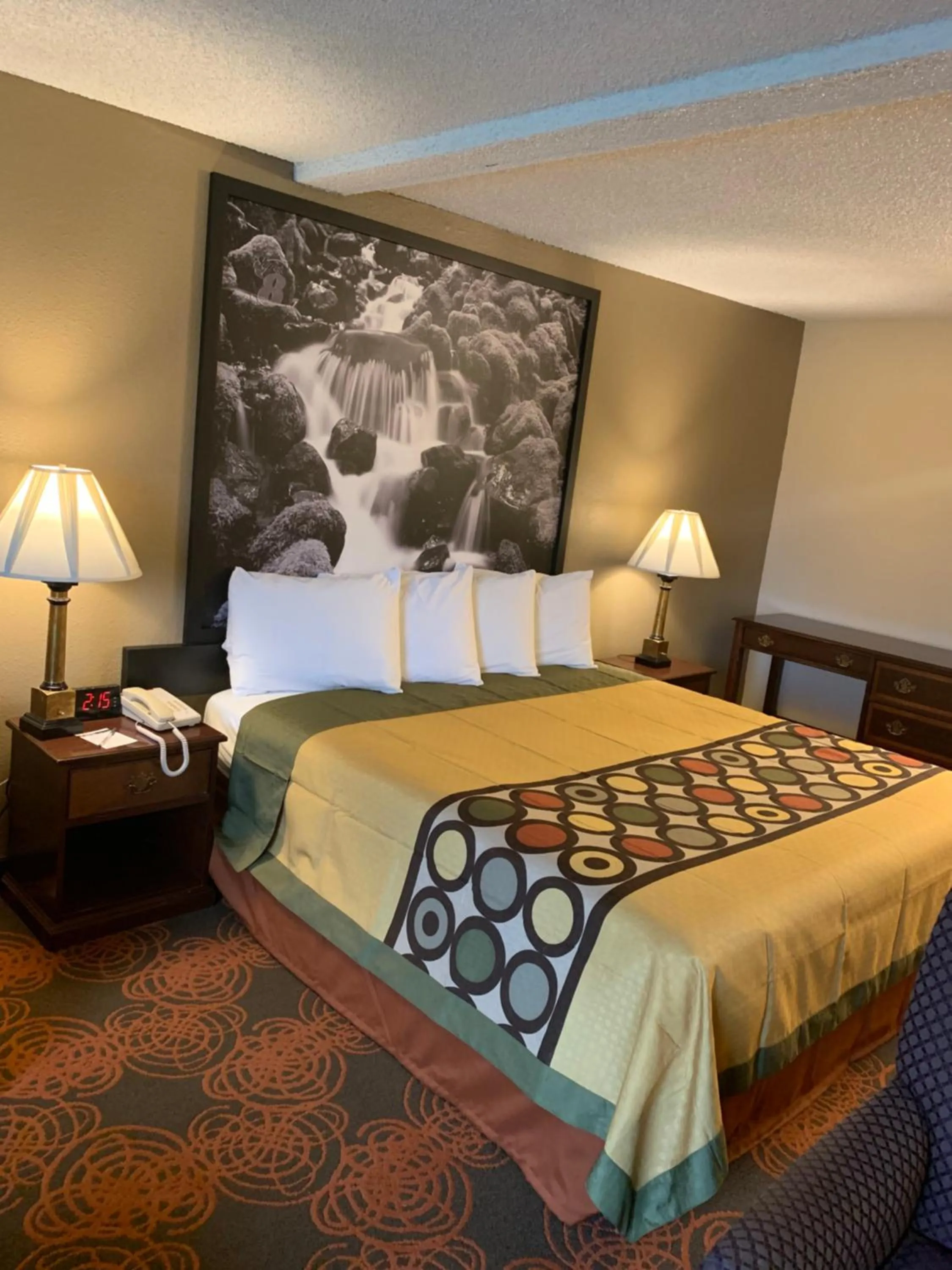 Bed in Sutton Suites Hotel