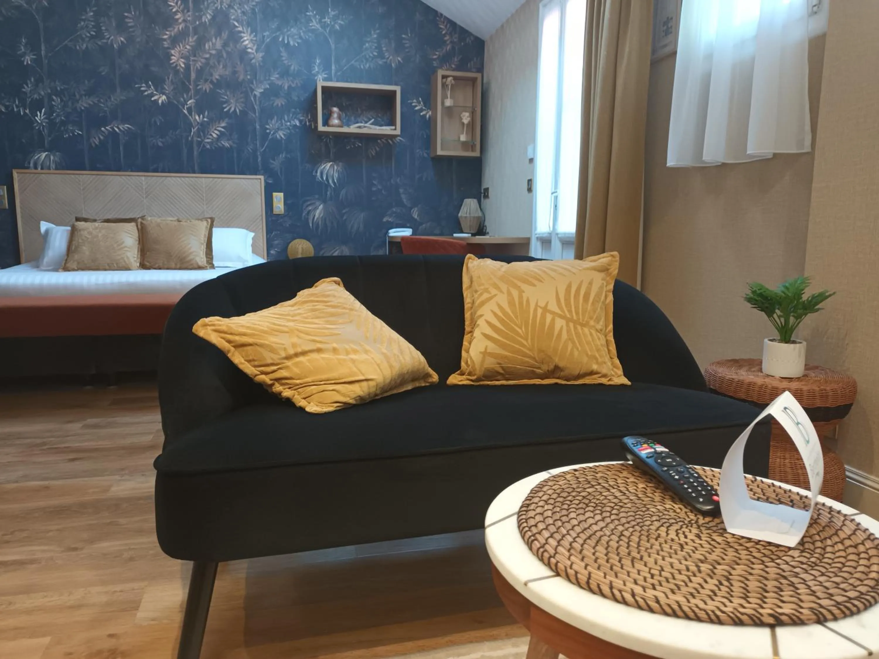 Seating area, Bed in Logis Hôtel La Brèche - Restaurant Berthelot