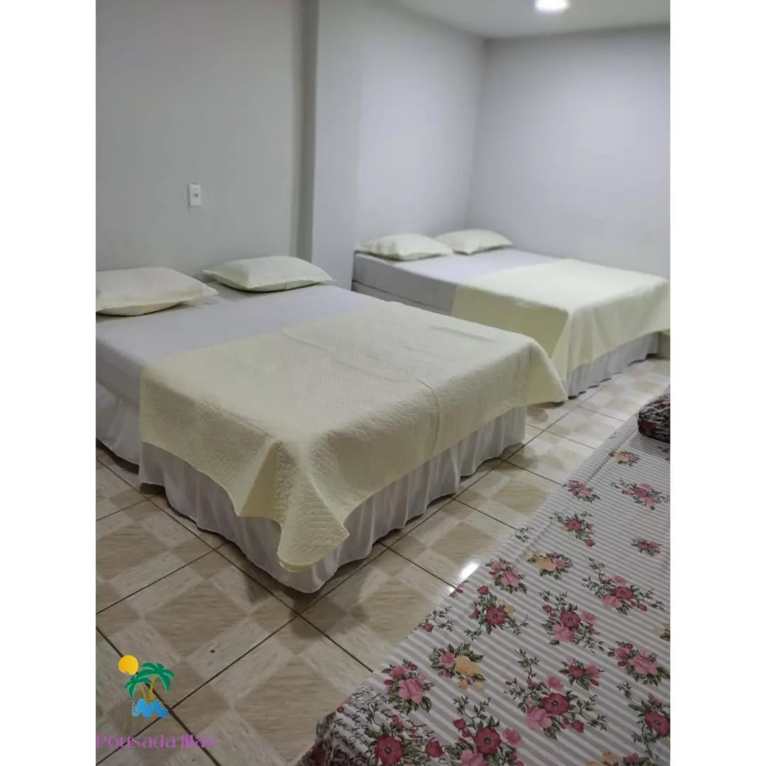 Bed in Pousada Lilás