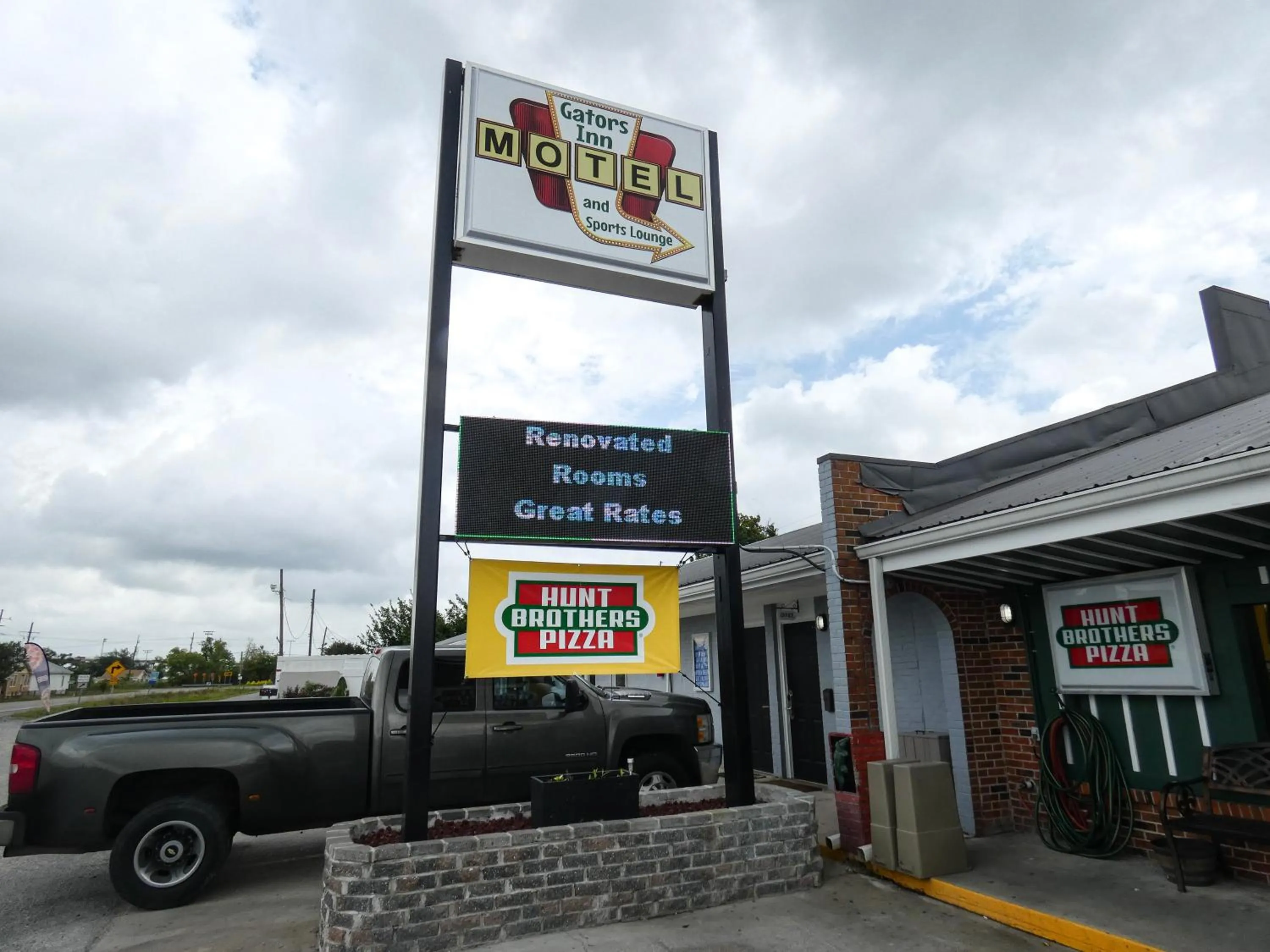 Property logo or sign in Gators Inn on the Bayou