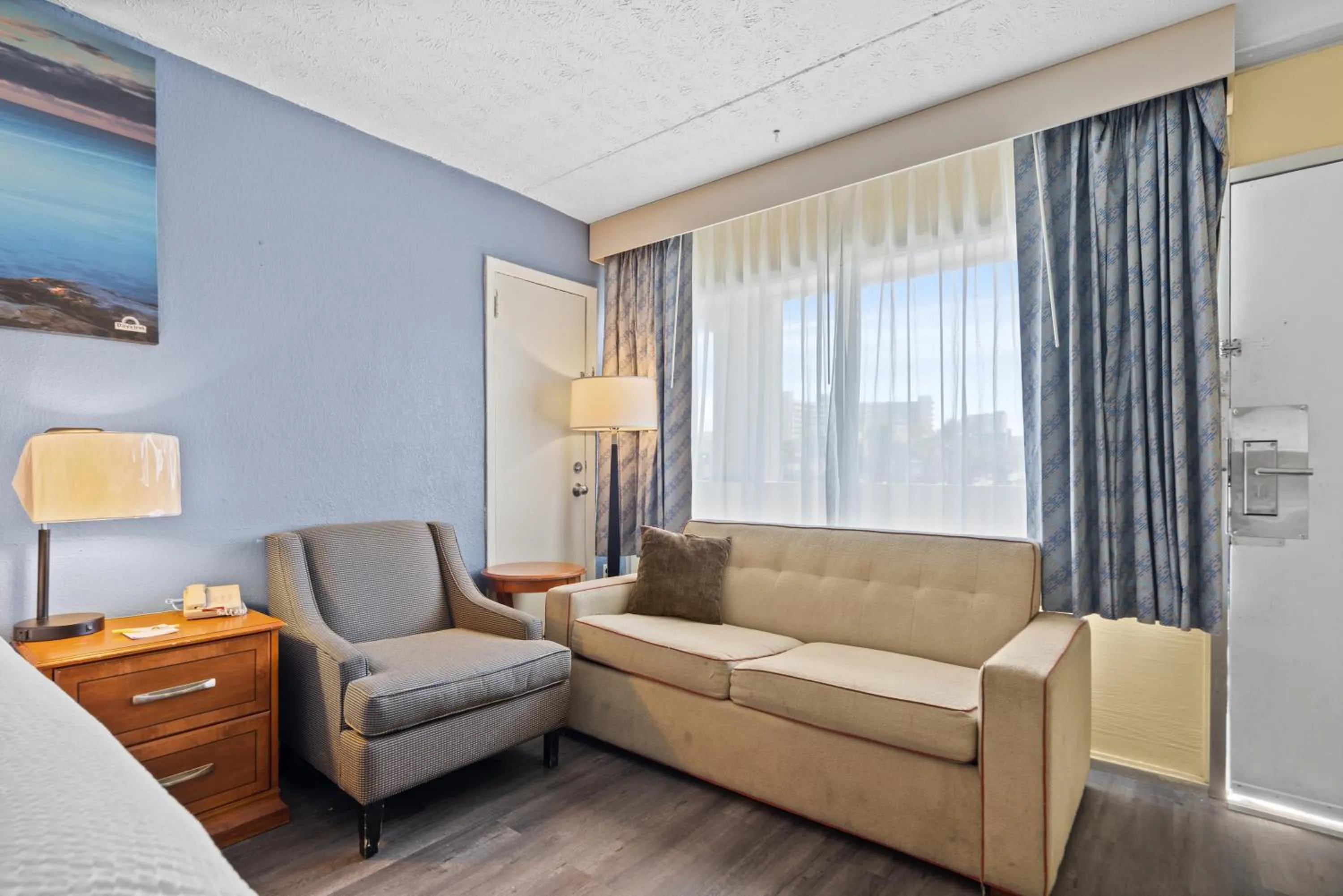 Living room, Seating Area in Days Inn by Wyndham Myrtle Beach-Grand Strand