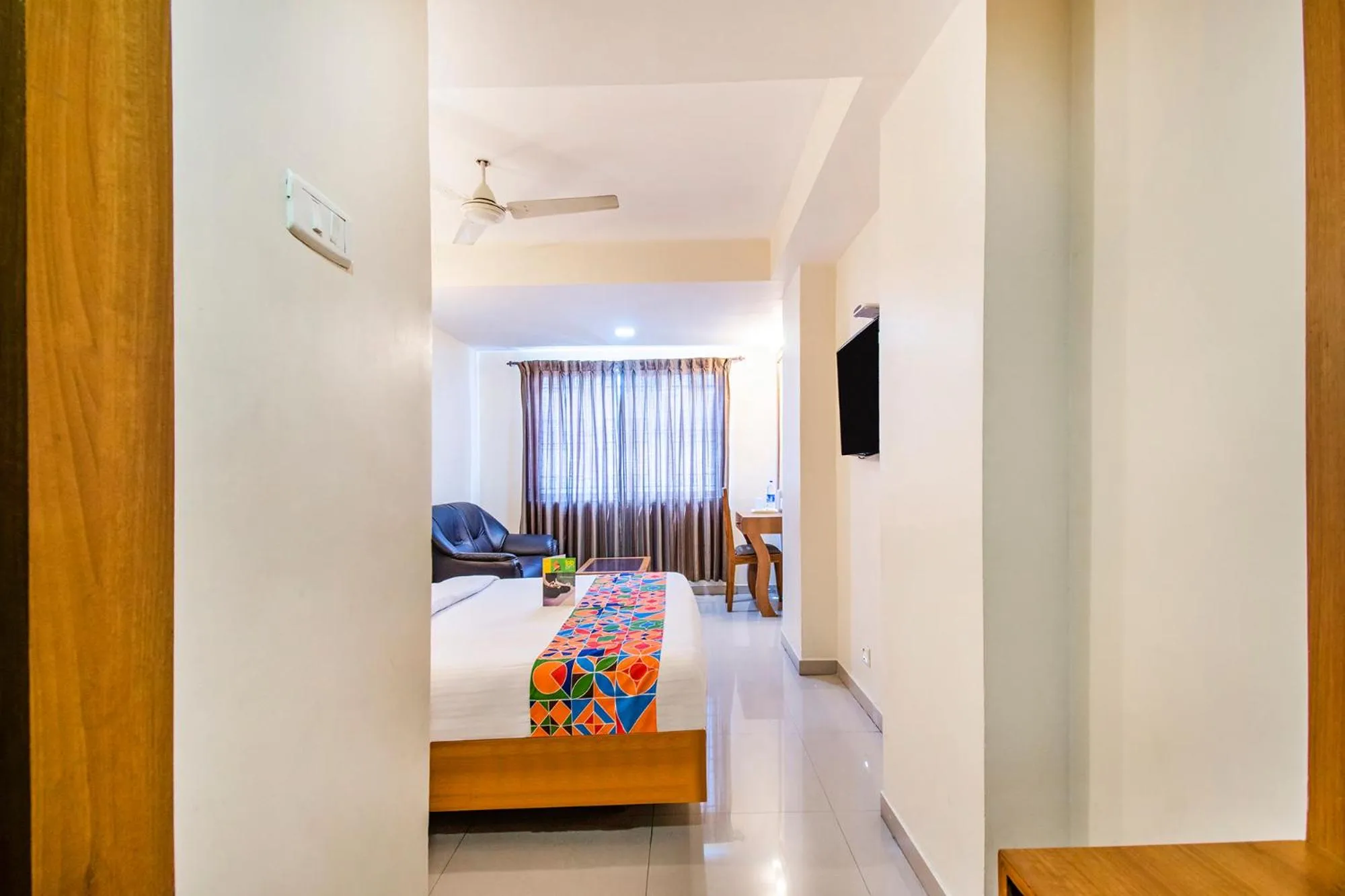 Bed in FabHotel Jansi Deluxe - Nr Gandhipuram Bus stand
