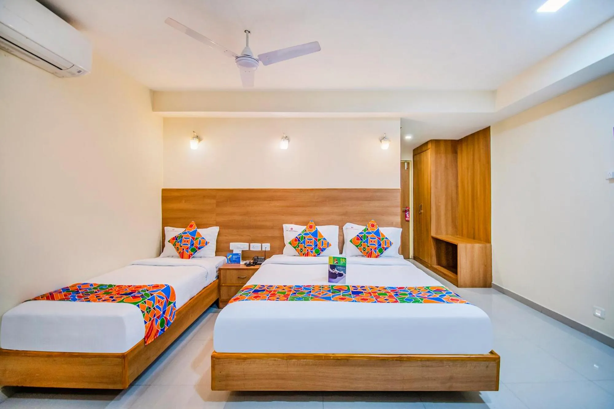 Bed in FabHotel Jansi Deluxe - Nr Gandhipuram Bus stand