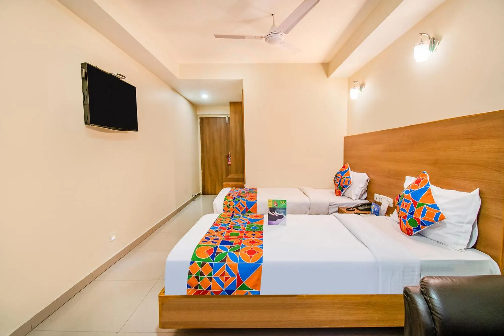 Bed in FabHotel Jansi Deluxe - Nr Gandhipuram Bus stand