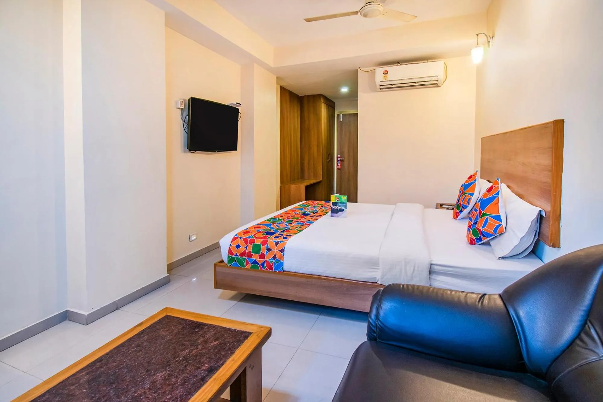 Bed in FabHotel Jansi Deluxe - Nr Gandhipuram Bus stand