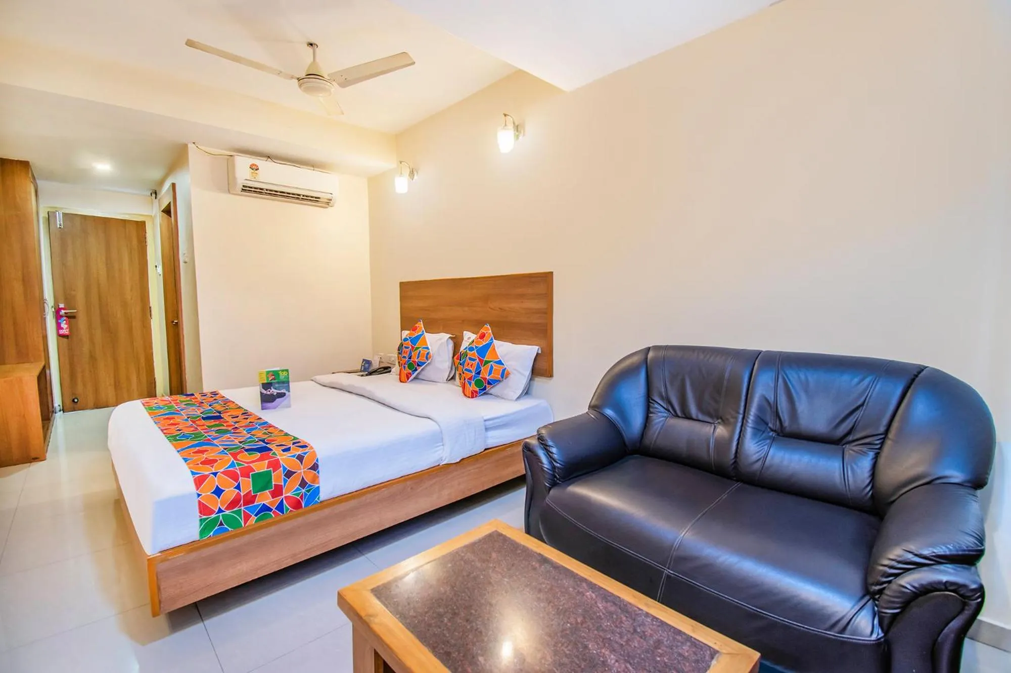 Bed in FabHotel Jansi Deluxe - Nr Gandhipuram Bus stand