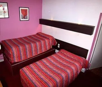 Photo of the whole room, Bed in Hôtel Du Stade