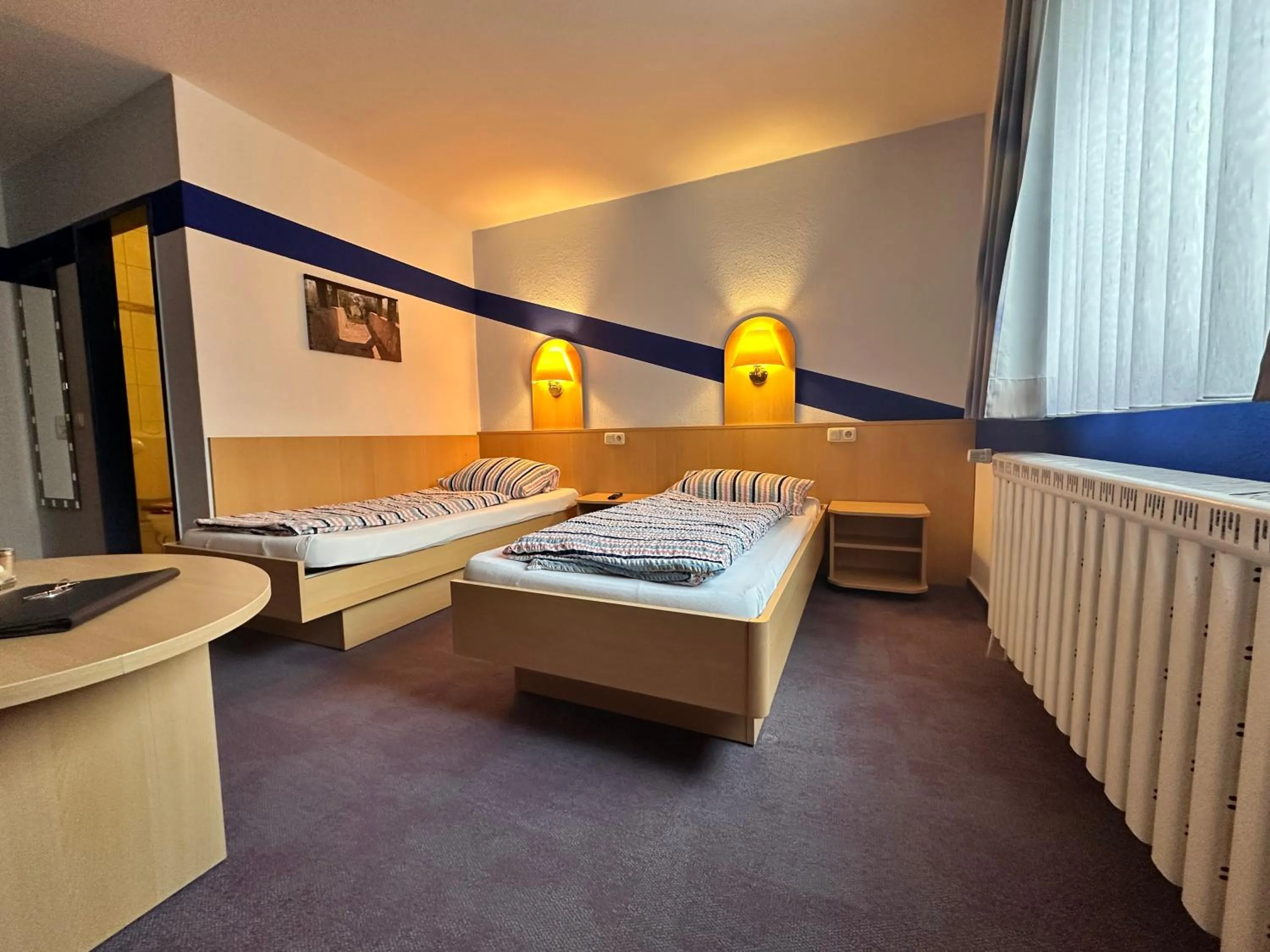 Bed in Zeitwohnen Wolfsburg, ehemals Hotel am Klieversberg ein Unternehmen der Micha'S Hotelbetriebe