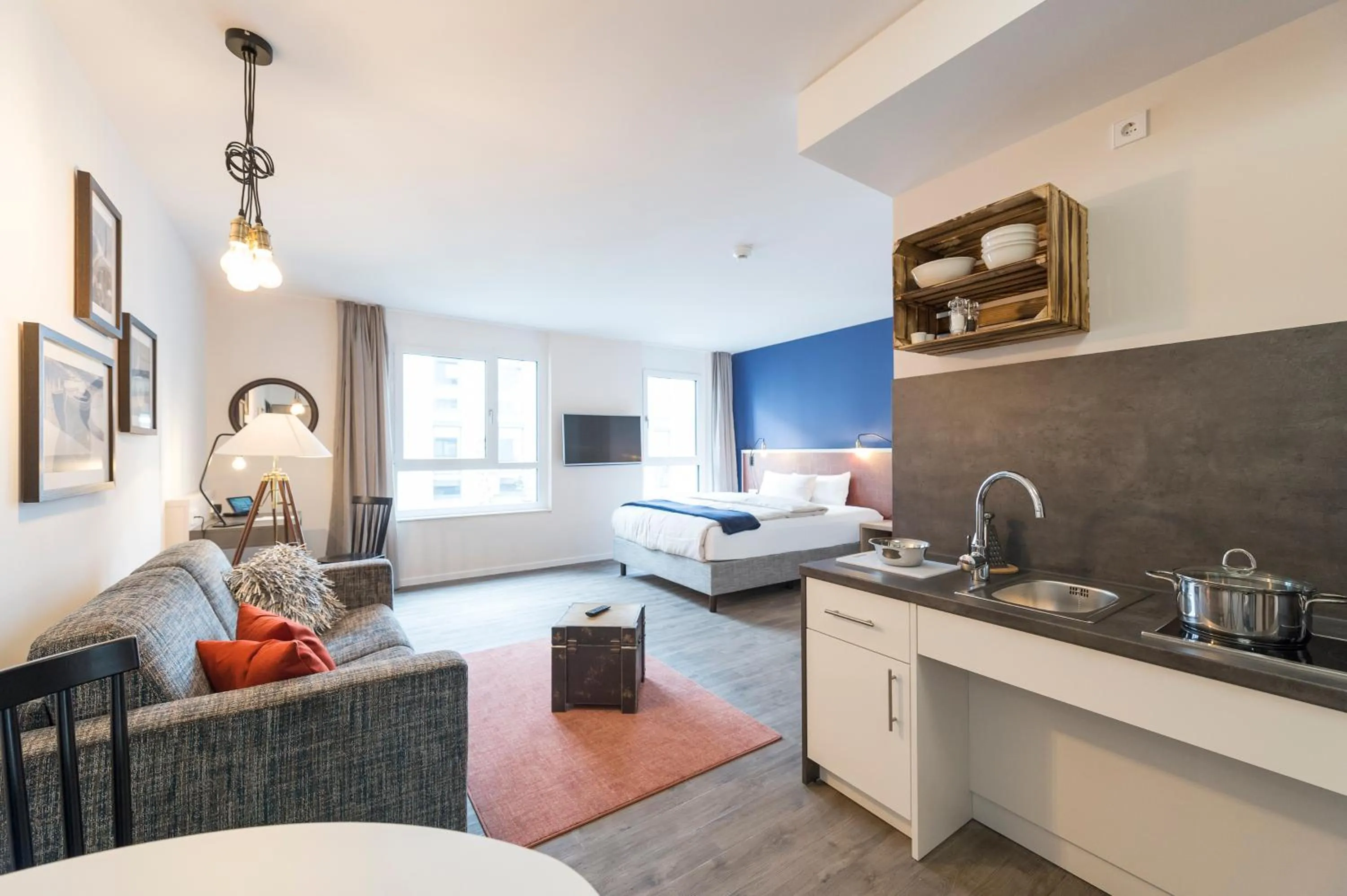 Kitchen or kitchenette, Bed in HARBR. boardinghouse Ludwigsburg