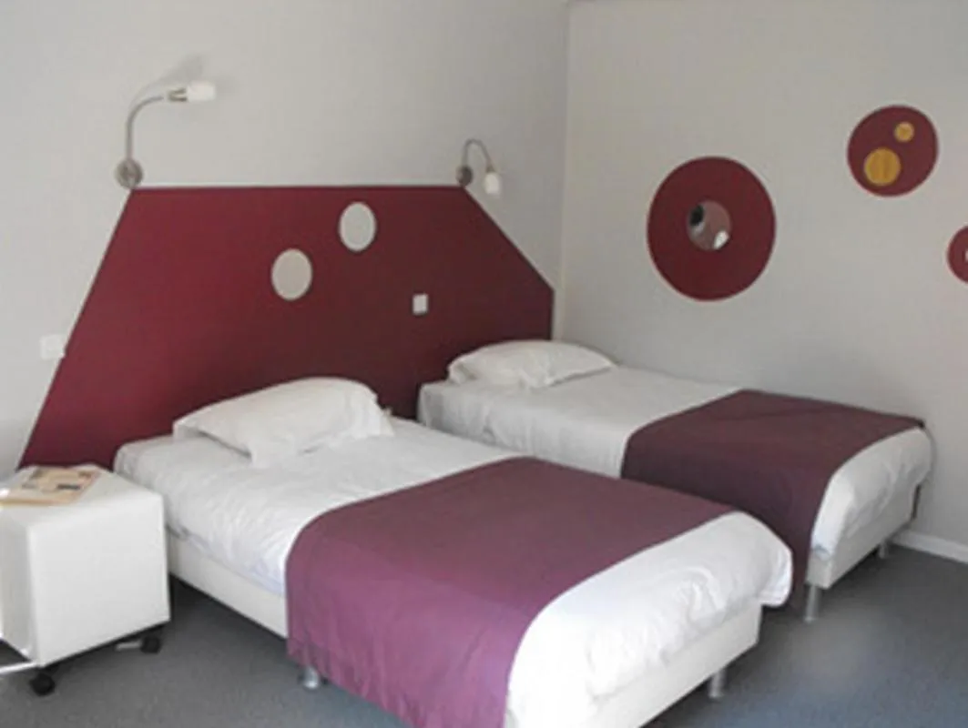 Photo of the whole room, Bed in Logis Hôtel Restaurant Les Capucins
