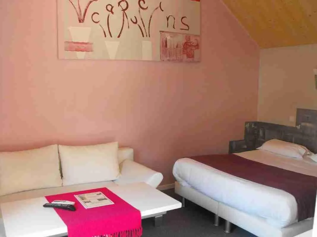 Photo of the whole room, Bed in Logis Hôtel Restaurant Les Capucins