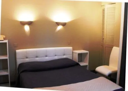 Photo of the whole room, Bed in Logis Hôtel Restaurant Les Capucins