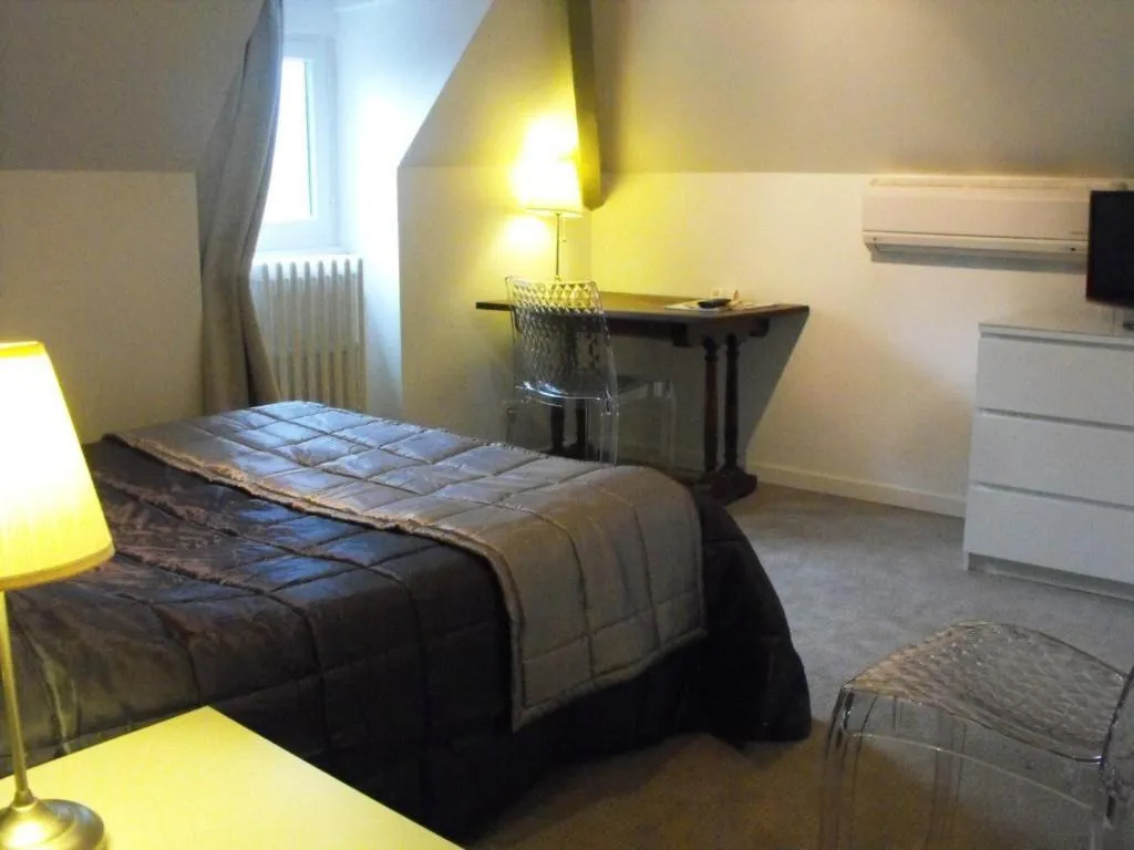 Photo of the whole room, Bed in Logis Hôtel Restaurant Les Capucins