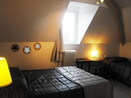 Bed in Logis Hôtel Restaurant Les Capucins