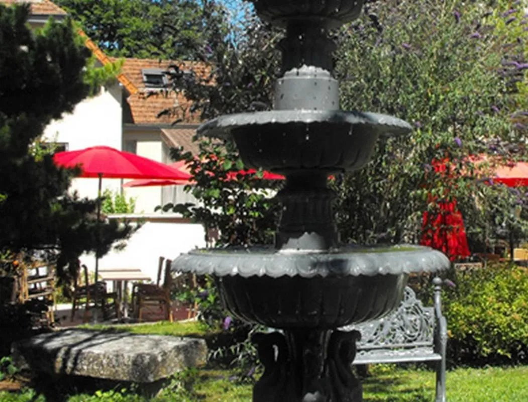 Garden in Logis Hôtel Restaurant Les Capucins