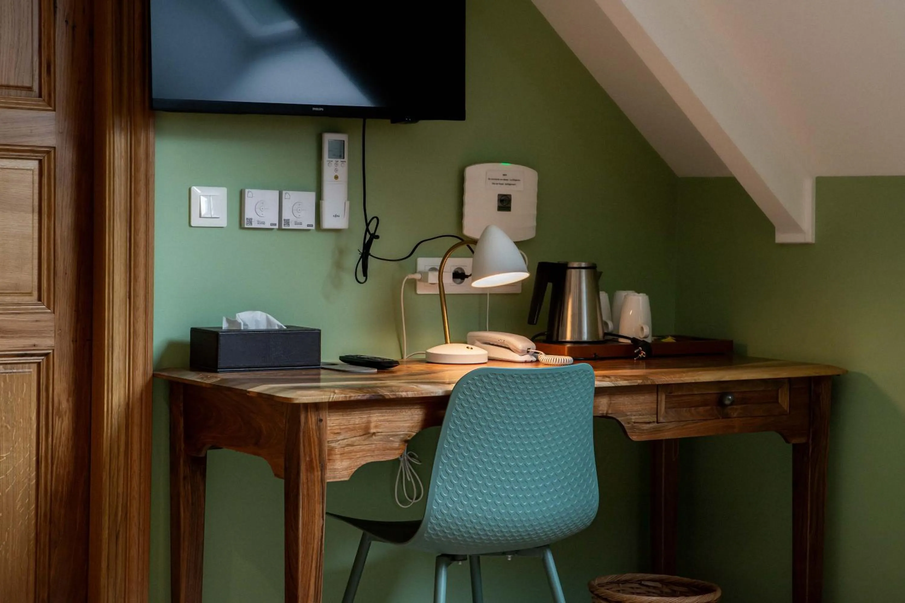 Bedroom in Logis Hotel La Diligence