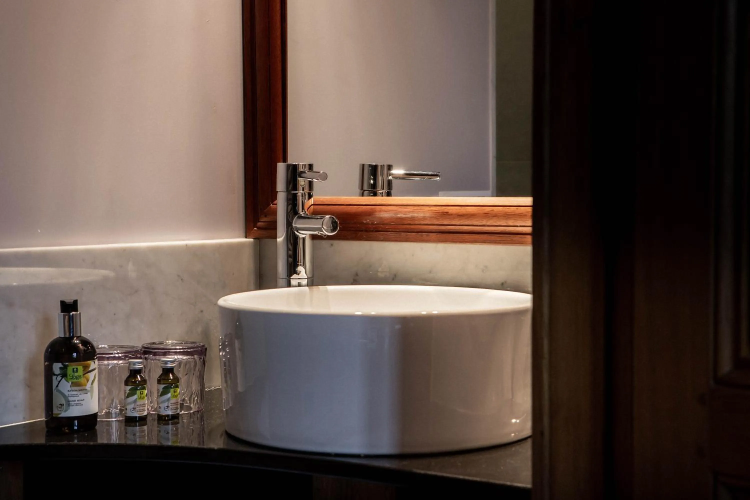 Bedroom in Logis Hotel La Diligence