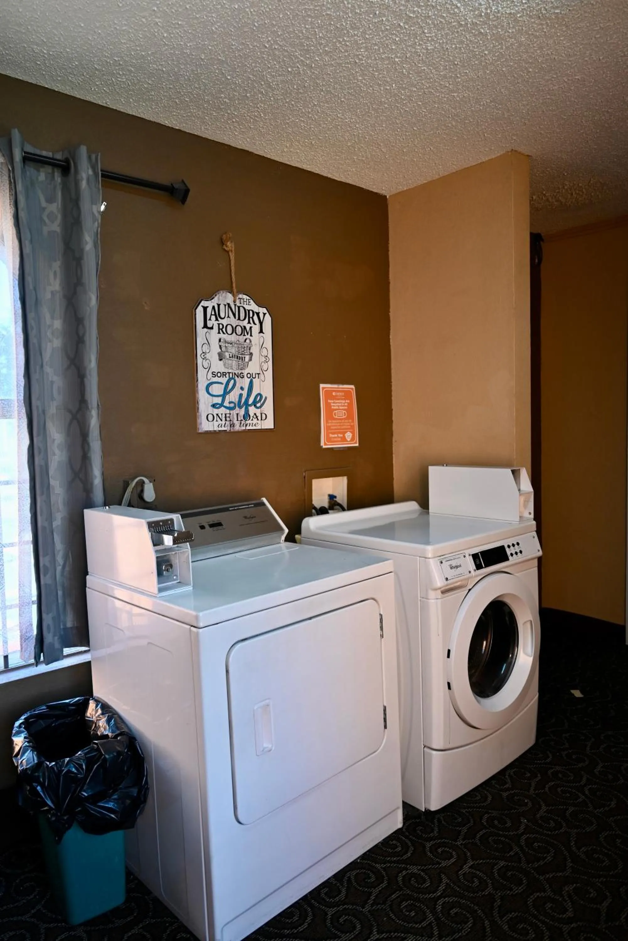 laundry in Quality Inn & Suites I-35 near Frost Bank Center