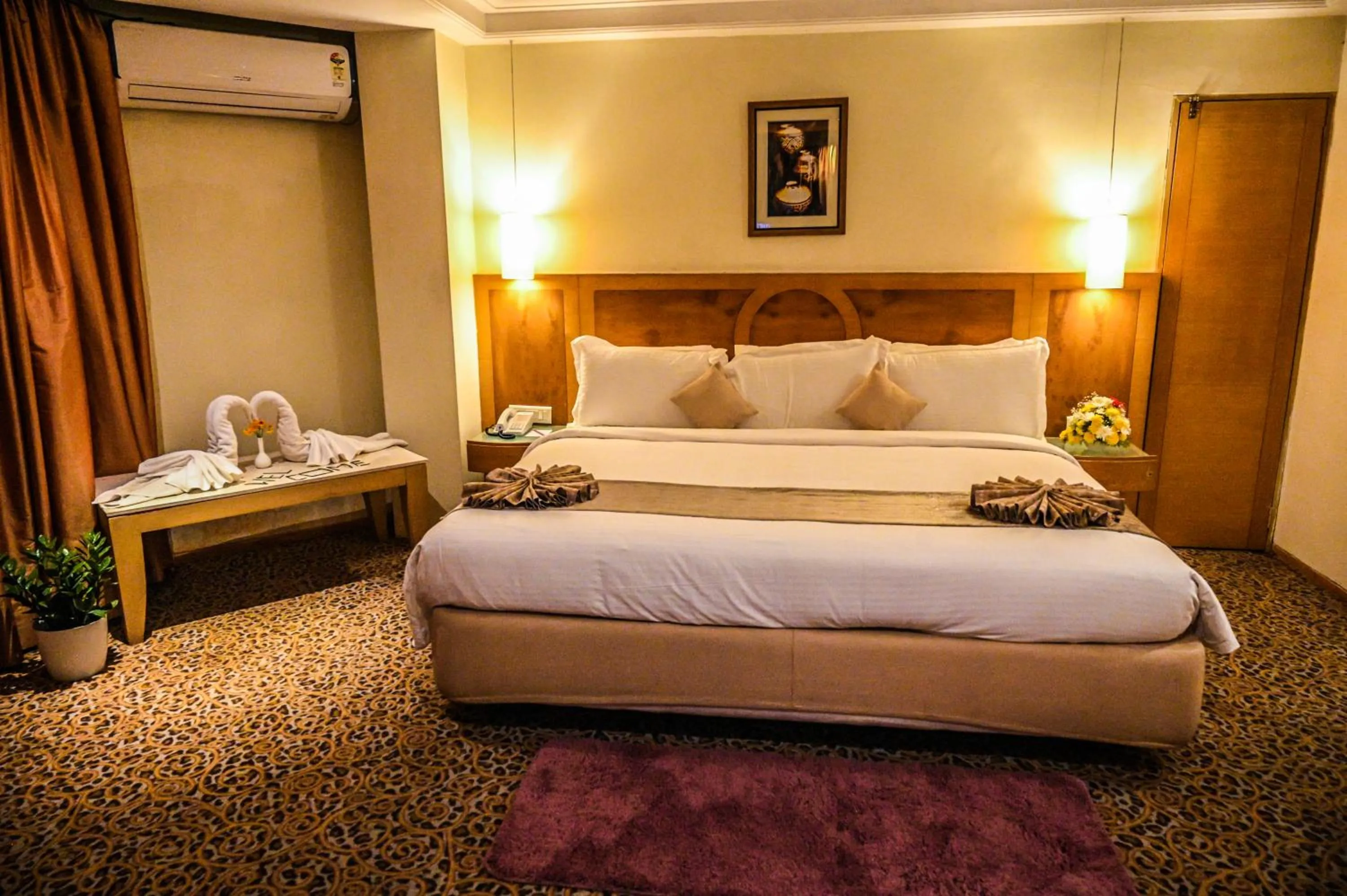Bed in Katriya Hotel and Tower