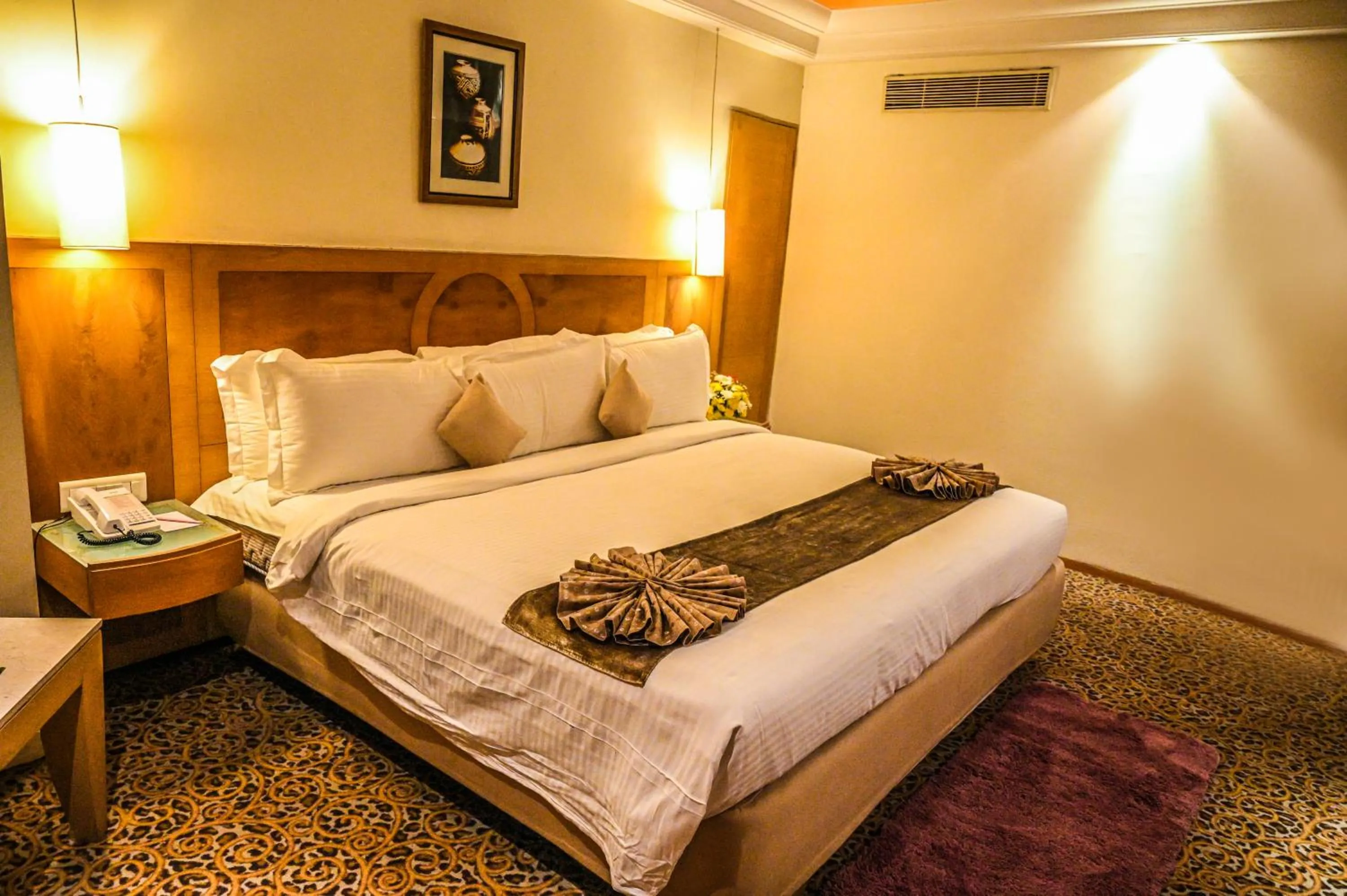 Bed in Katriya Hotel and Tower
