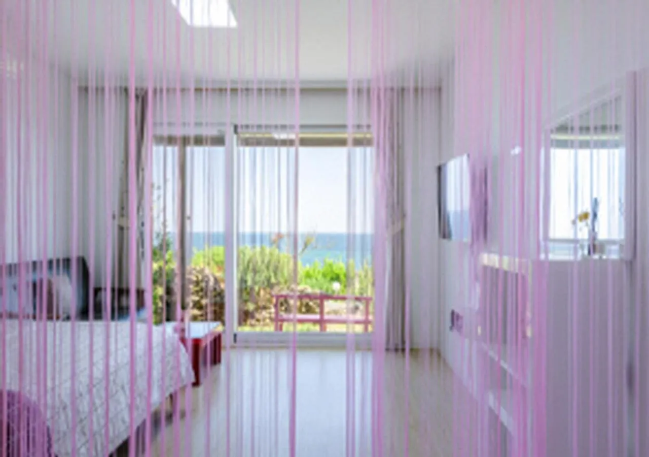 Living room, Bed in Jeju Turning point Pension