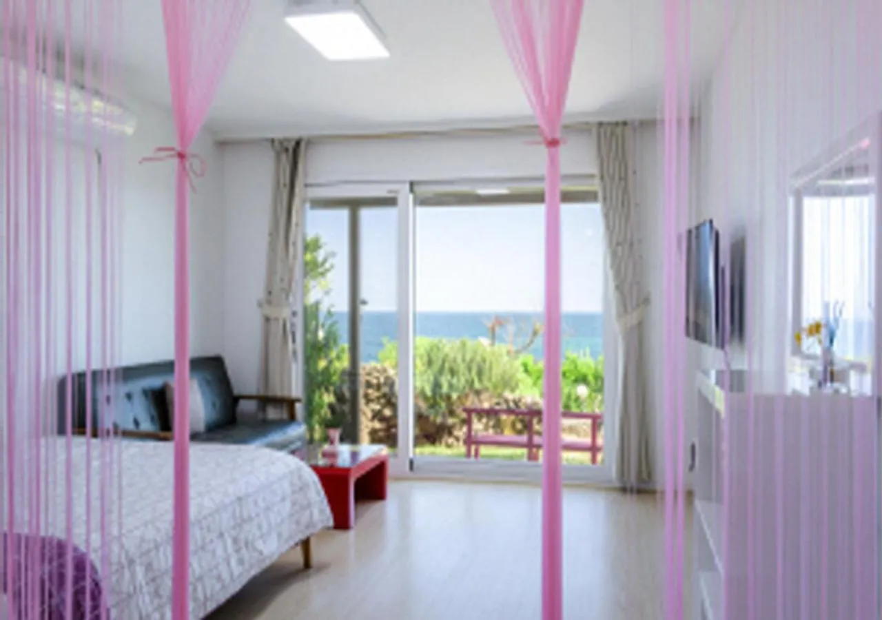 Living room, Bed in Jeju Turning point Pension