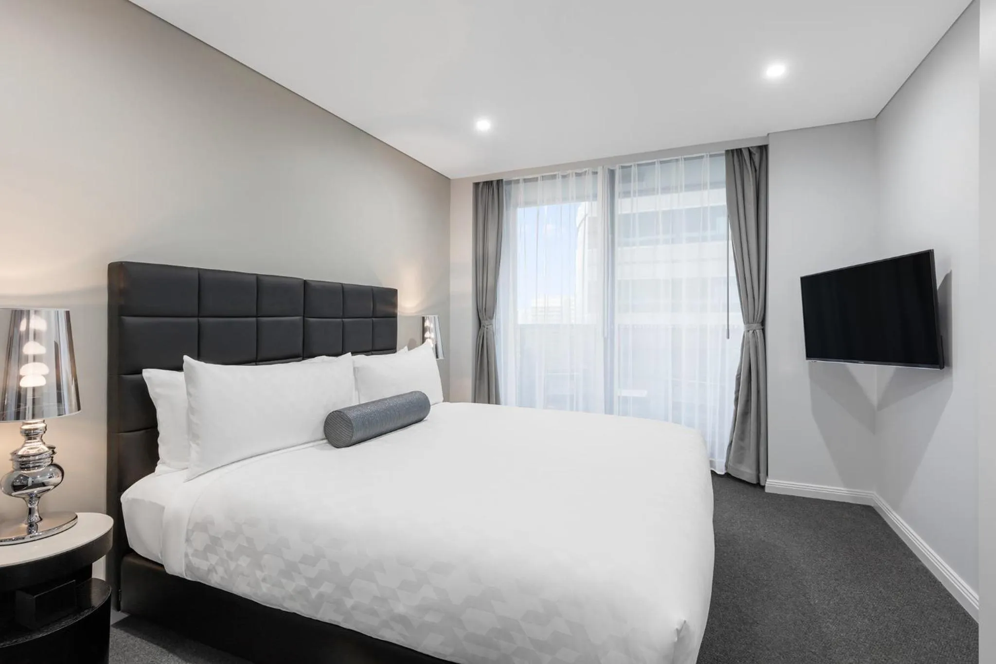 Bed in Meriton Suites North Sydney