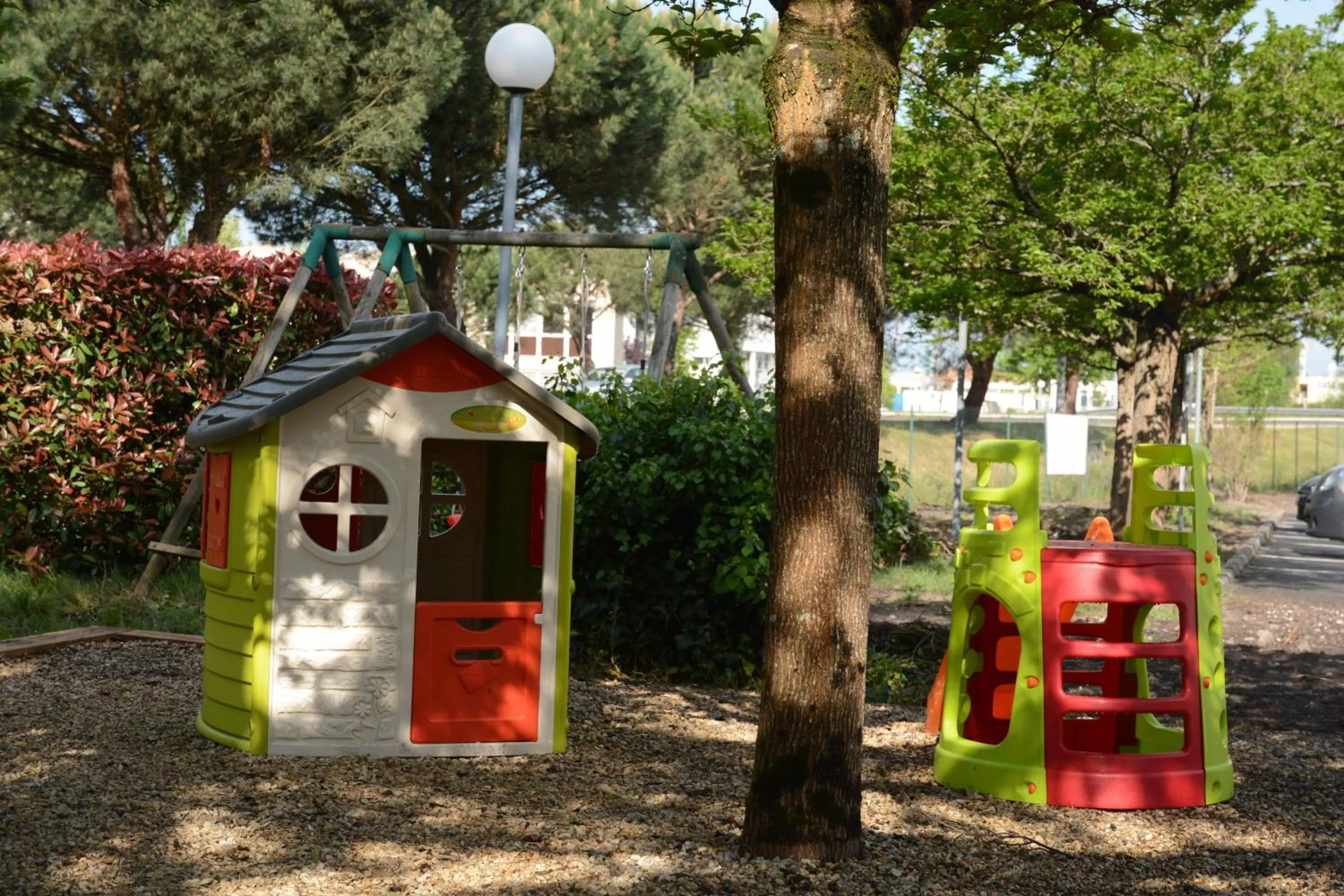 Children play ground in Logis Hotel Restaurant & SPA Au Comte d'Ornon