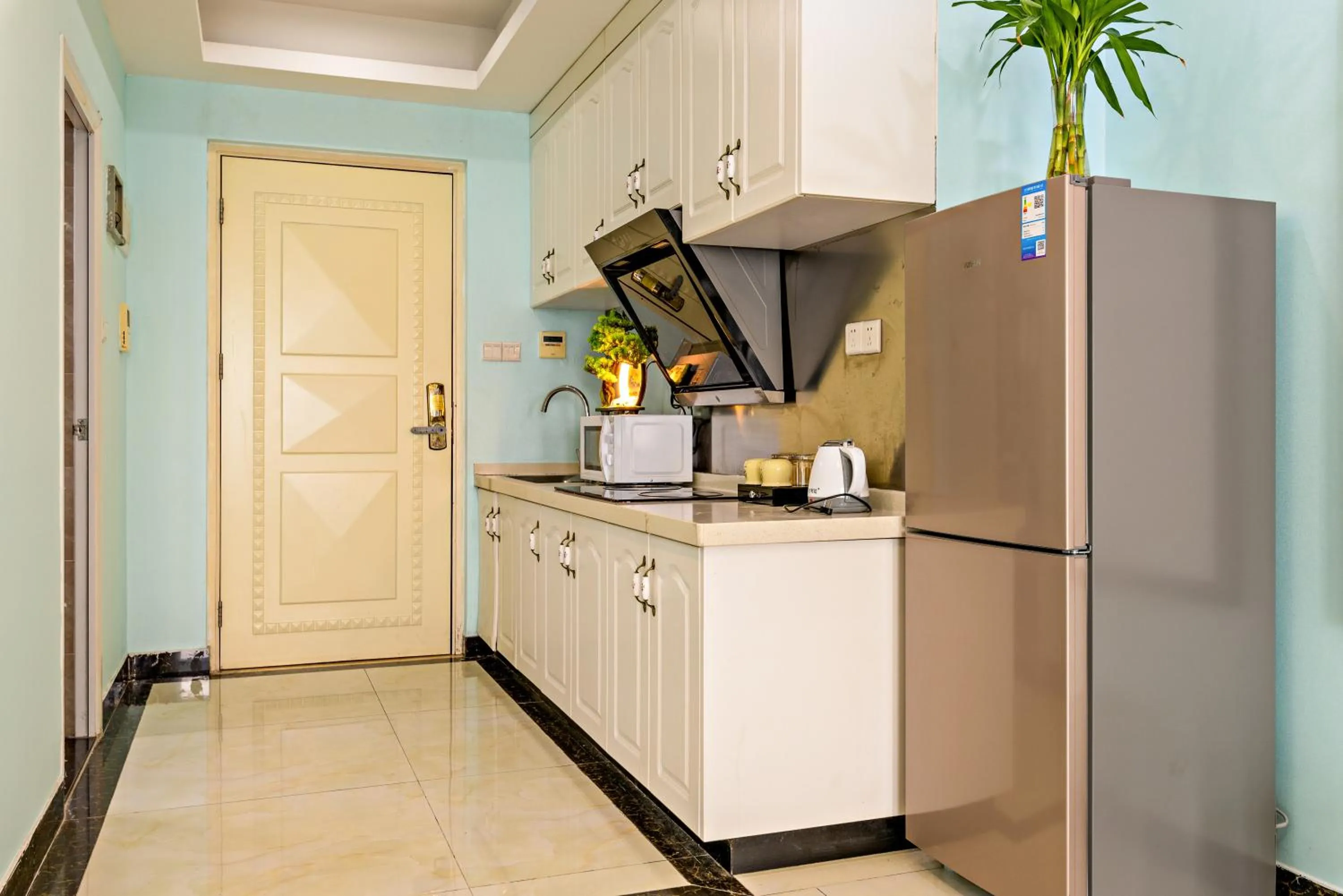 Kitchen or kitchenette in Guangzhou Manhattan International Apartment Zhengjia Free bus services are provided for the first and second phases