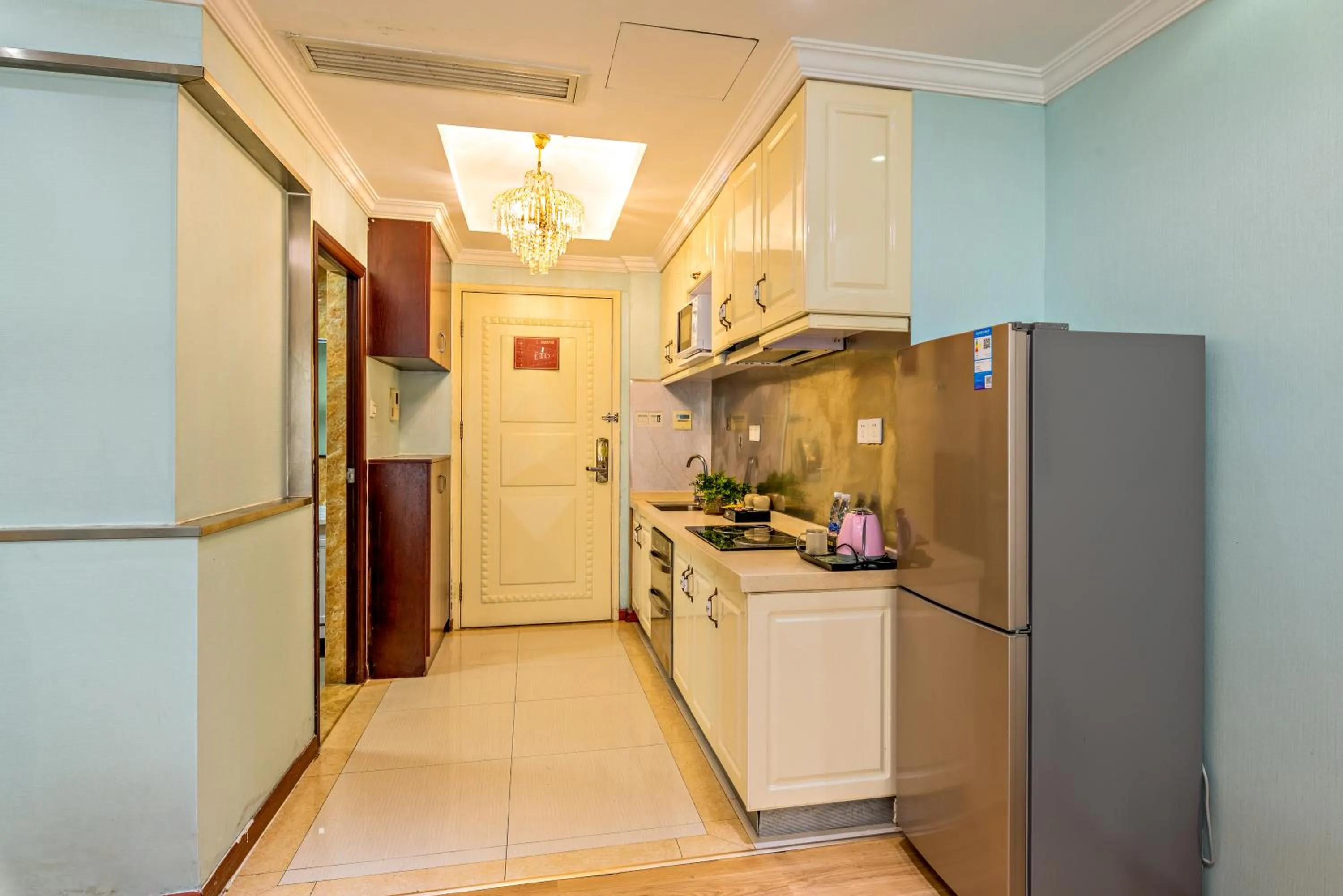 Kitchen or kitchenette in Guangzhou Manhattan International Apartment Zhengjia Free bus services are provided for the first and second phases