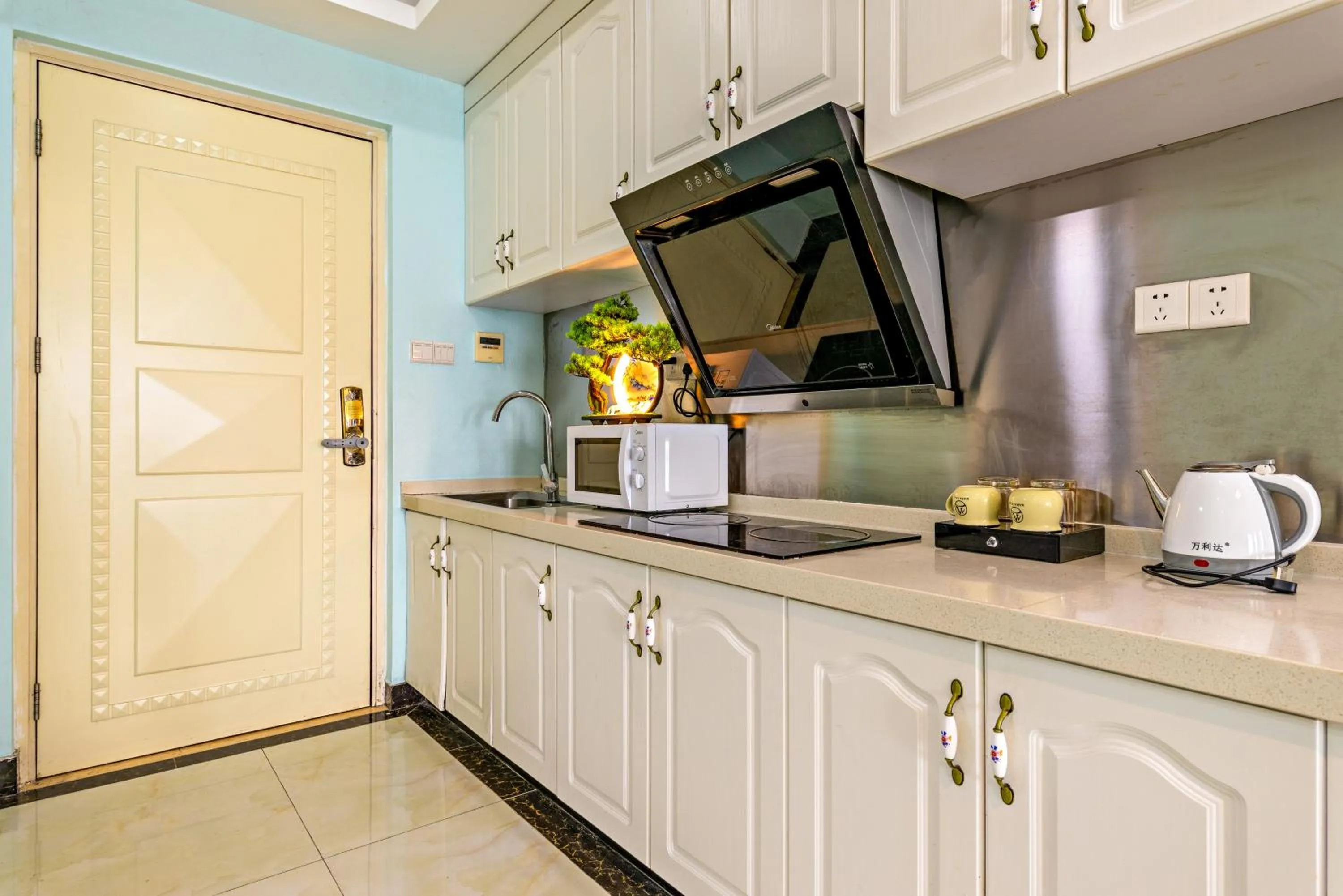 Kitchen or kitchenette in Guangzhou Manhattan International Apartment Zhengjia Free bus services are provided for the first and second phases