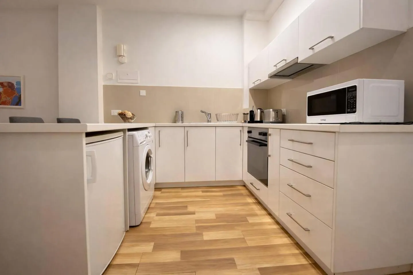 kitchen in SeaBreeze City Center Flats by TrulyCyprus