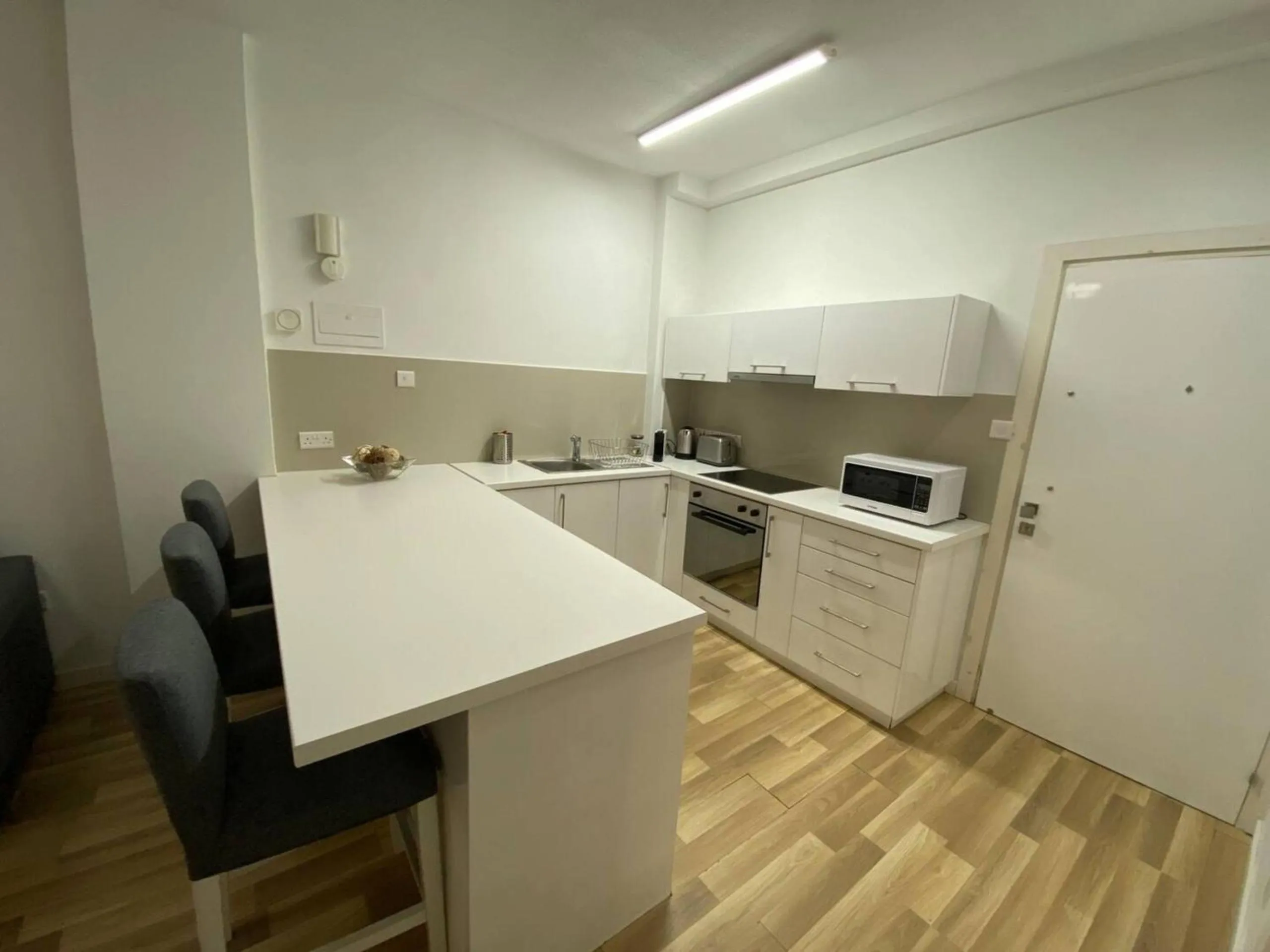 Dining area in SeaBreeze City Center Flats by TrulyCyprus