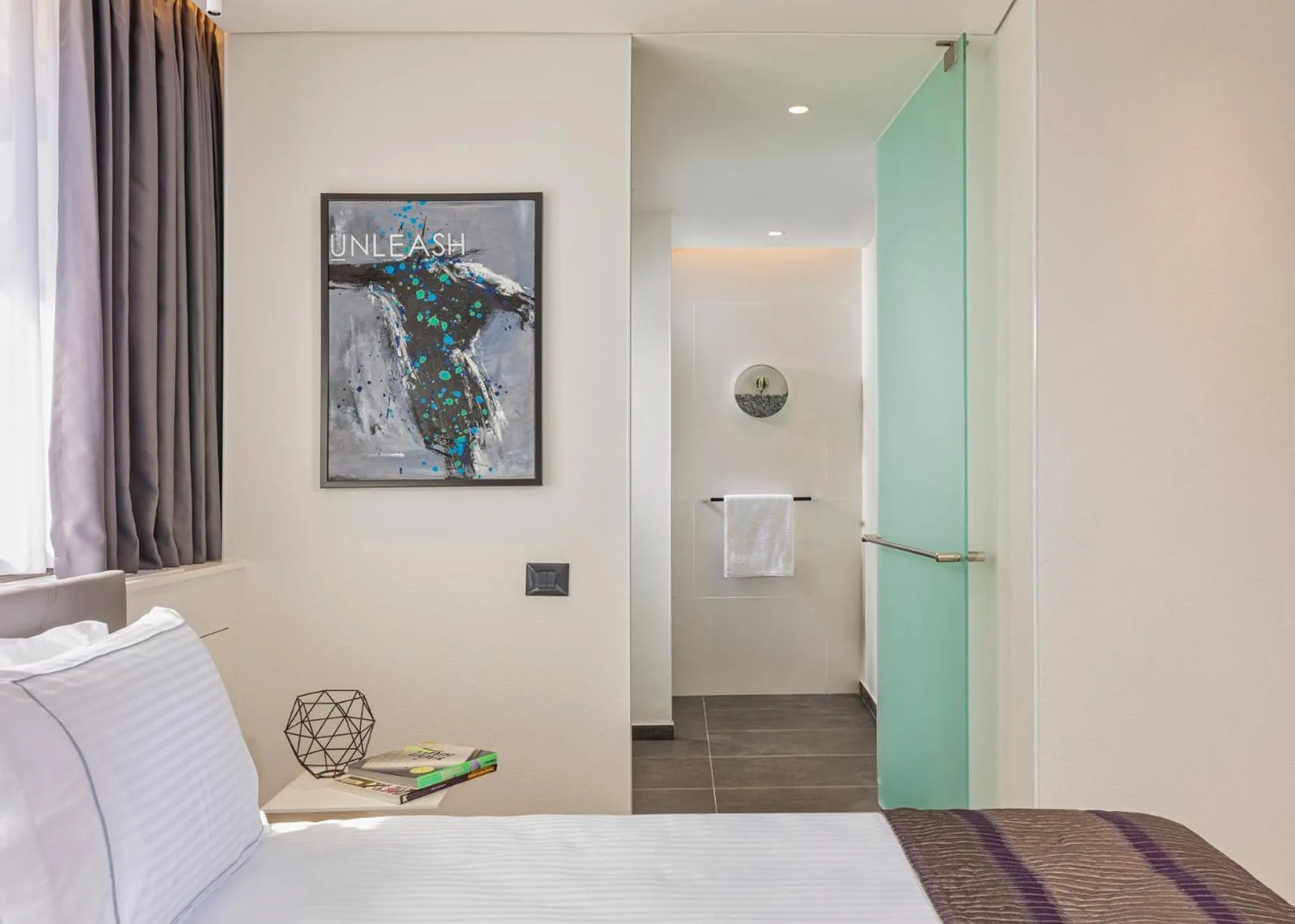 Living room, Bed in Ultra Tel Aviv Boutique Hotel