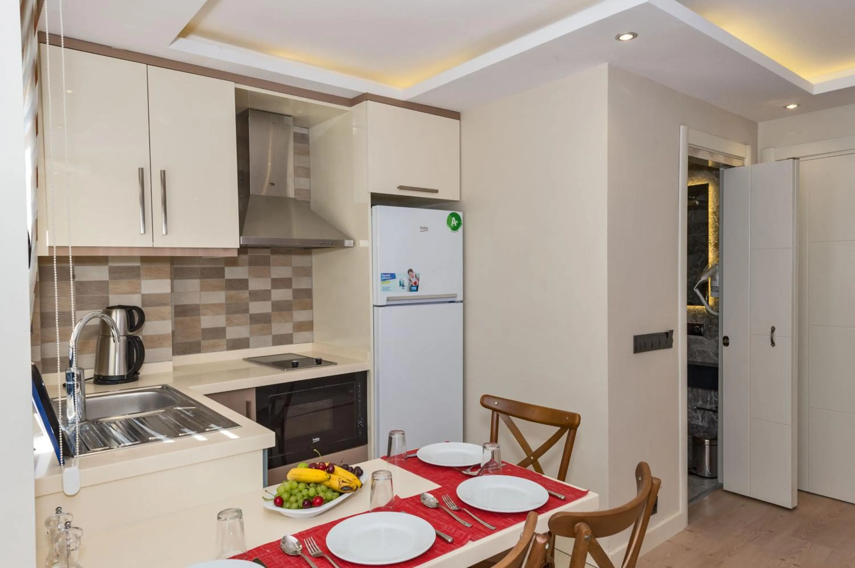 Kitchen or kitchenette in Gen Suites