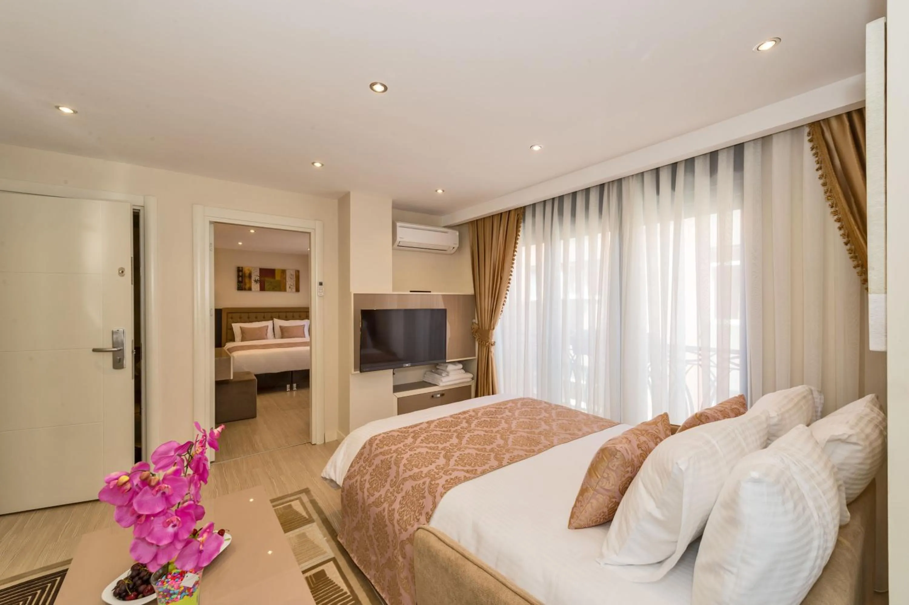 Photo of the whole room, Bed in Gen Suites