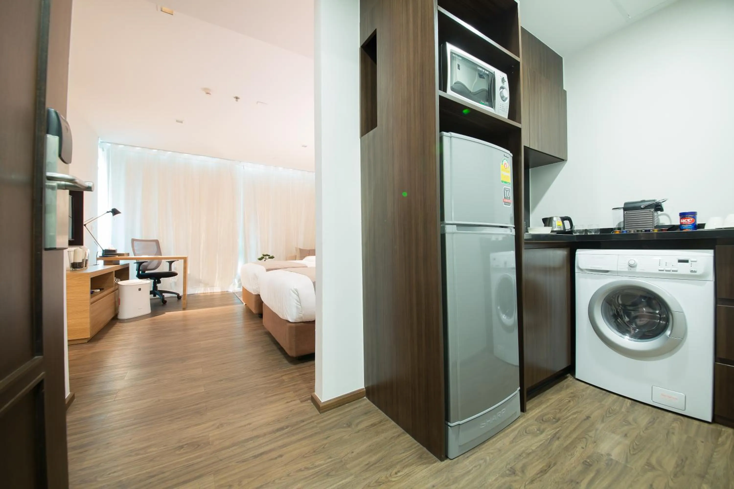 Kitchen or kitchenette, Bed in Civic Horizon Hotel & Residence