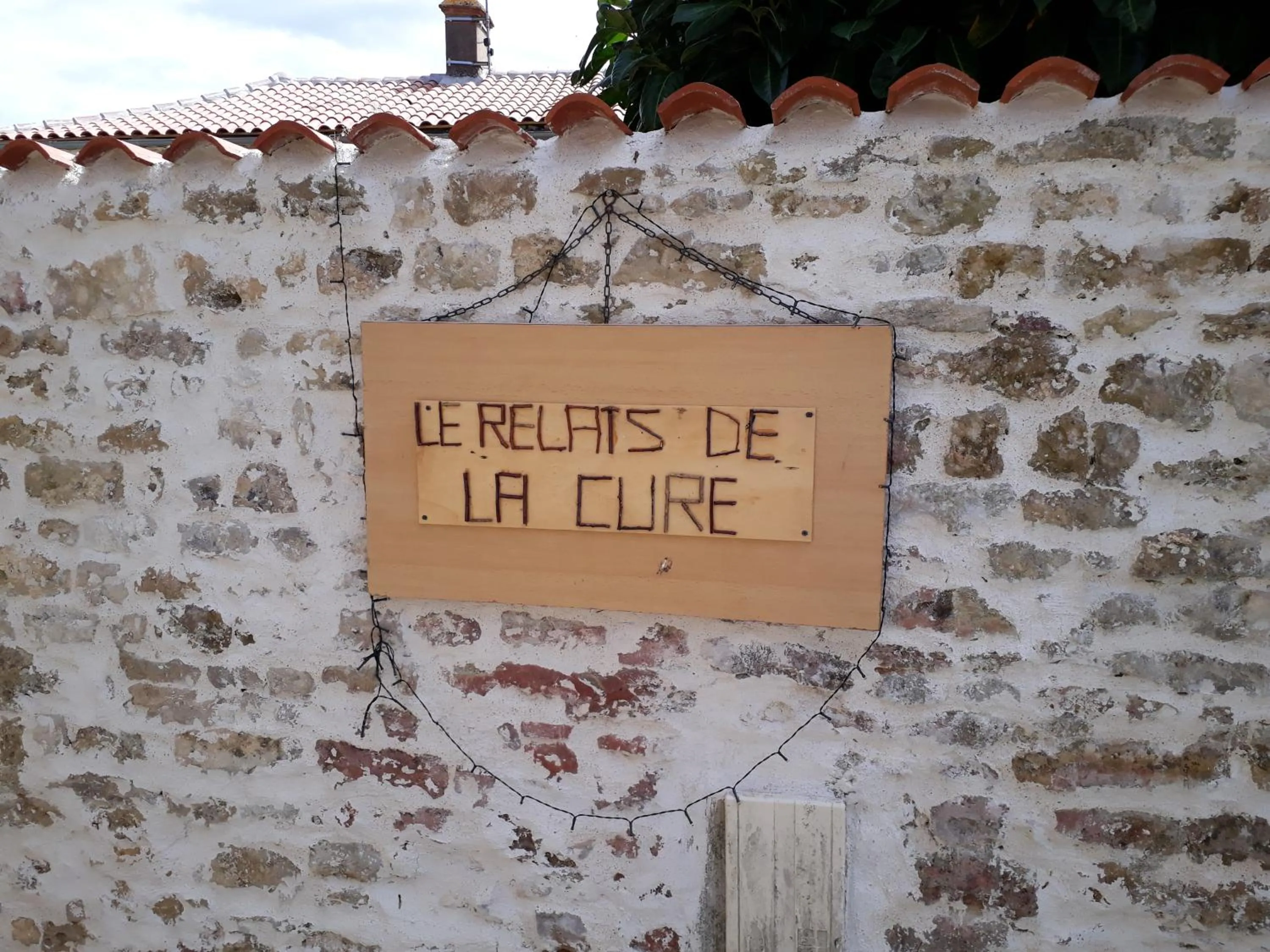 Property logo or sign in Le relais de la cure