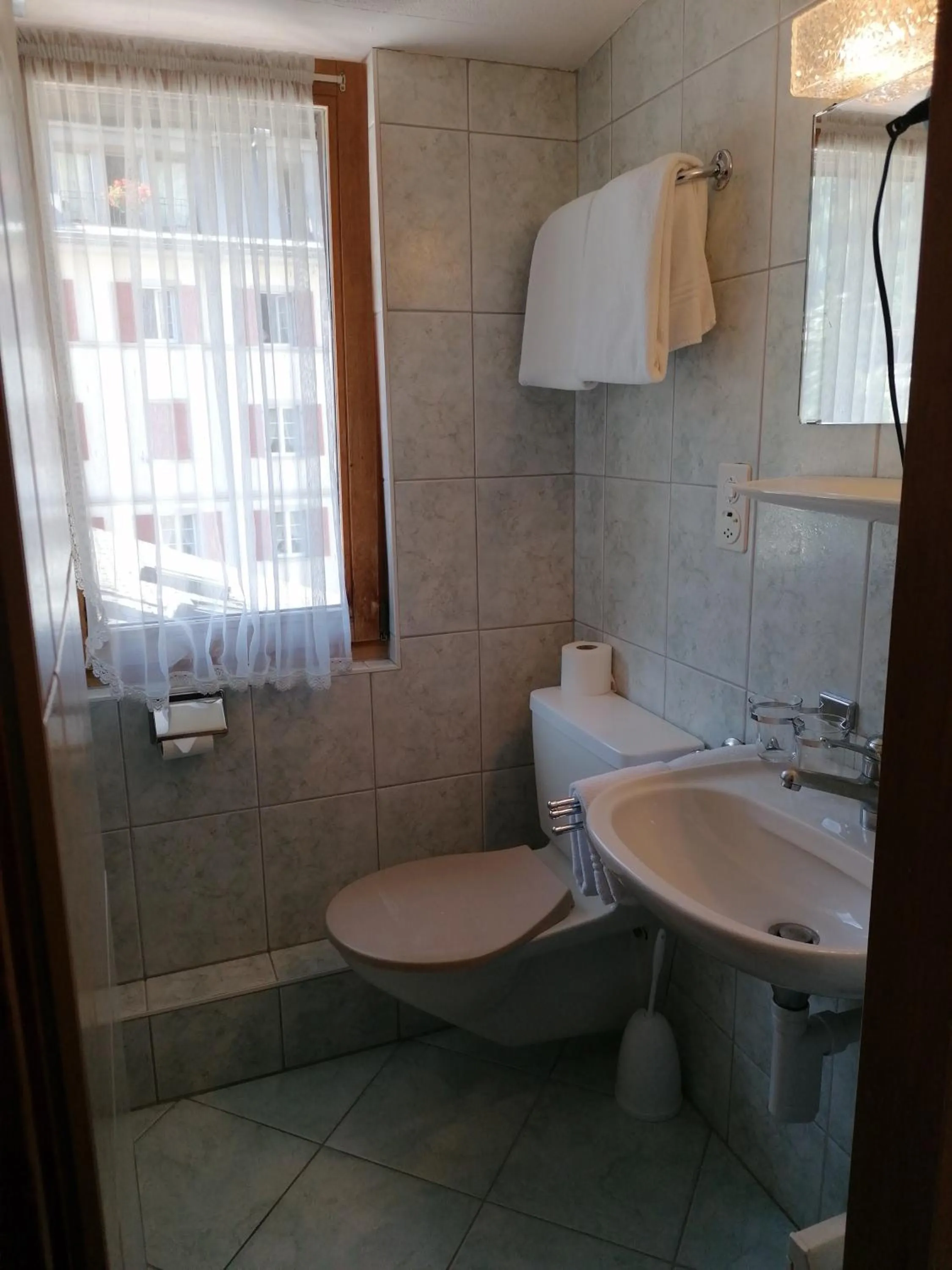 Bathroom in Petit Helvetia Budget Hotel