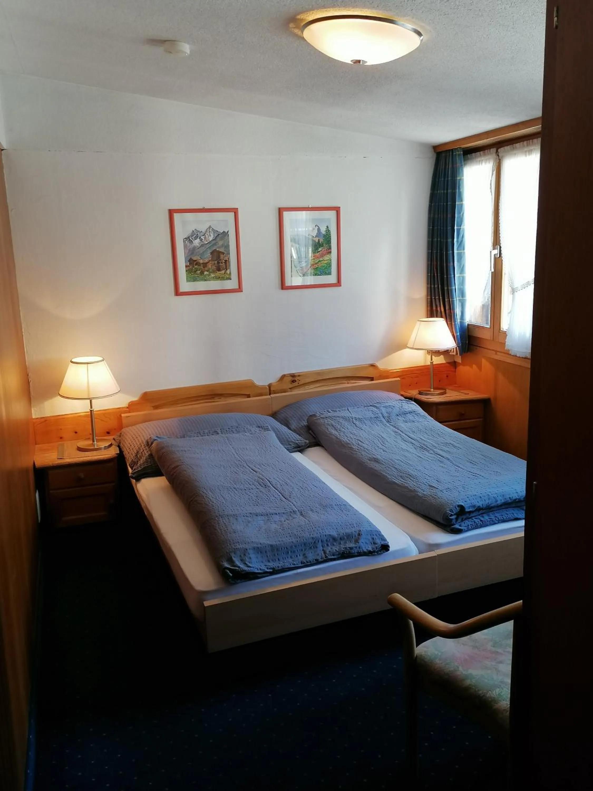 Photo of the whole room, Bed in Petit Helvetia Budget Hotel