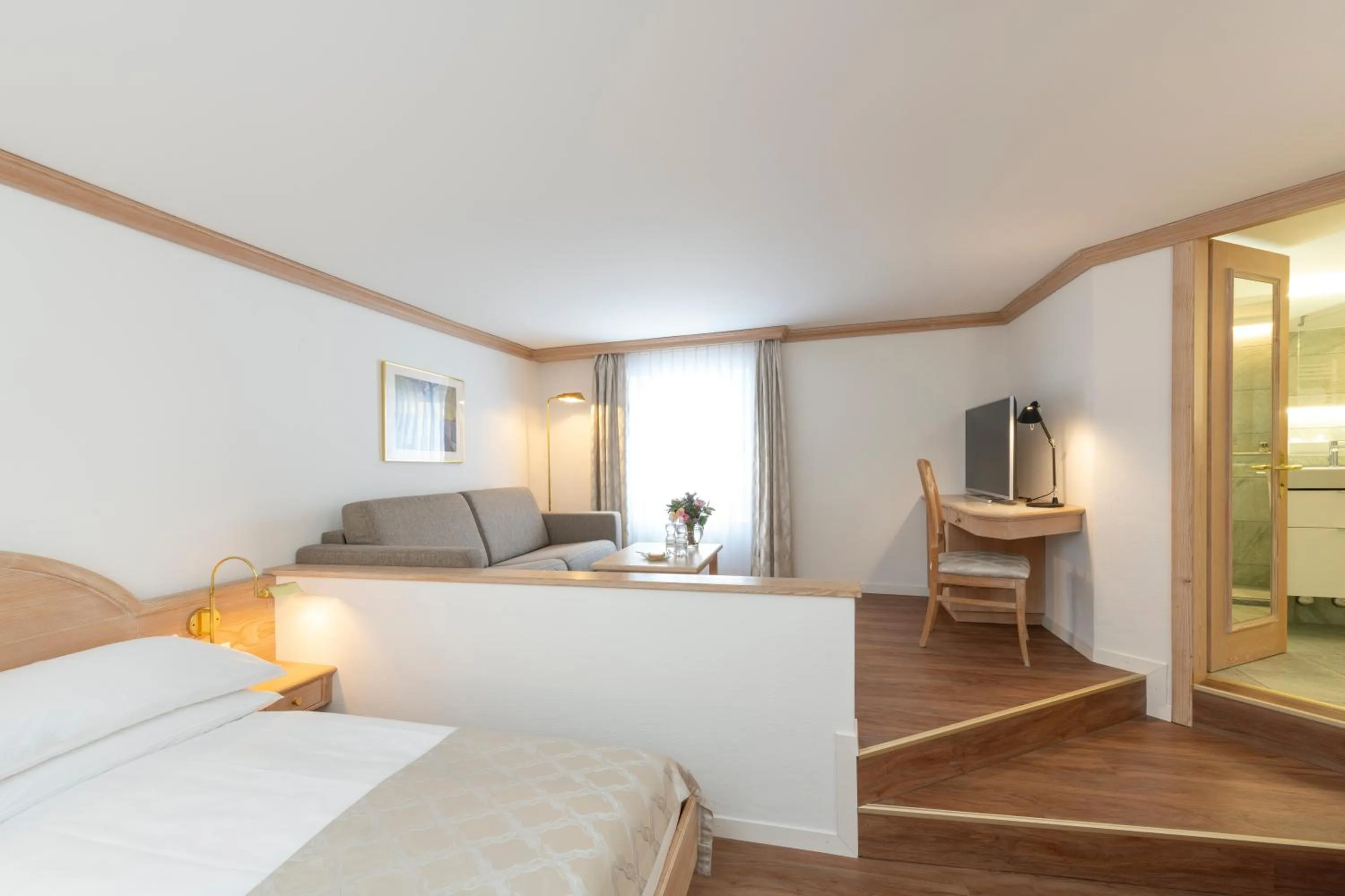 Living room, Bed in Hotel Post Sils Maria