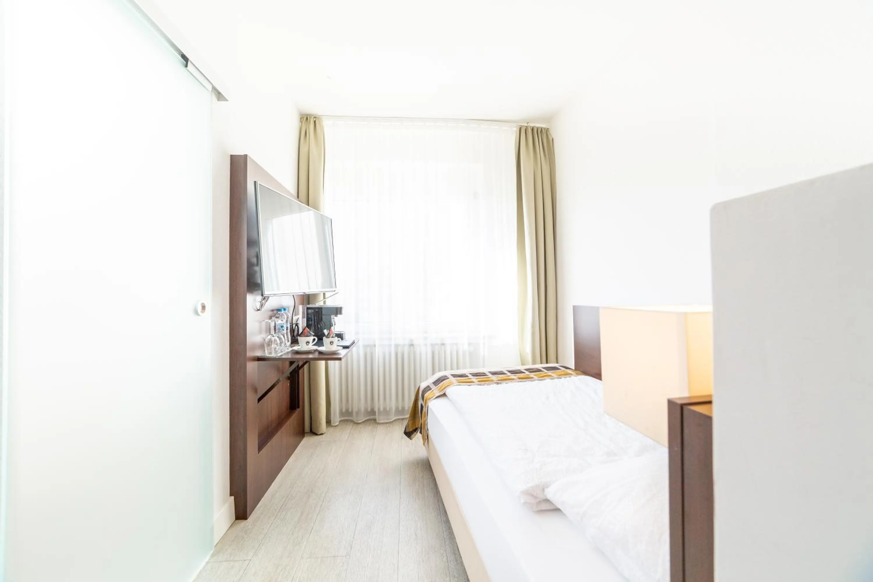 Bed in Hotel Rheinfelderhof