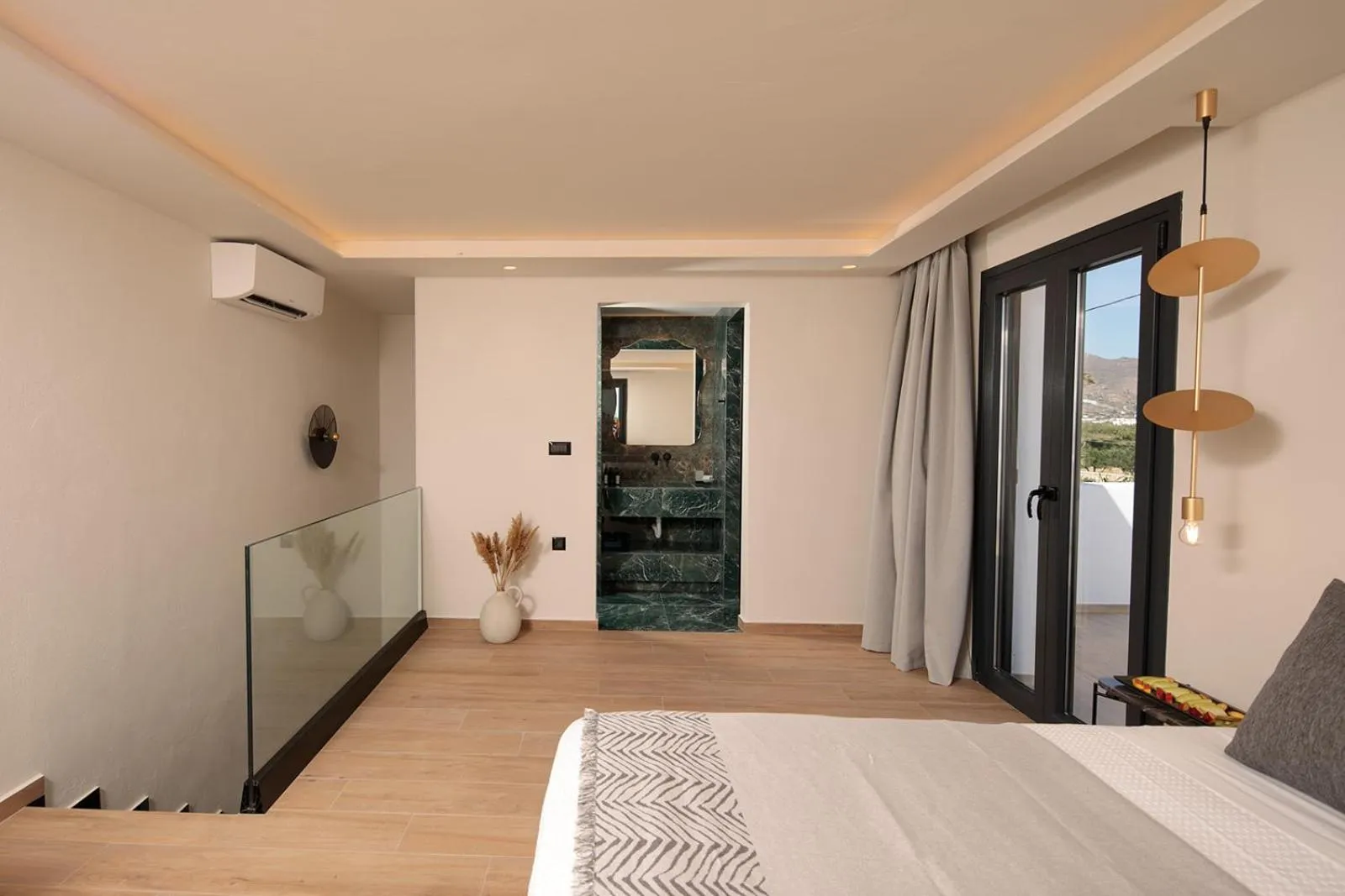 Bed in Iphimedeia Luxury Hotel & Suites