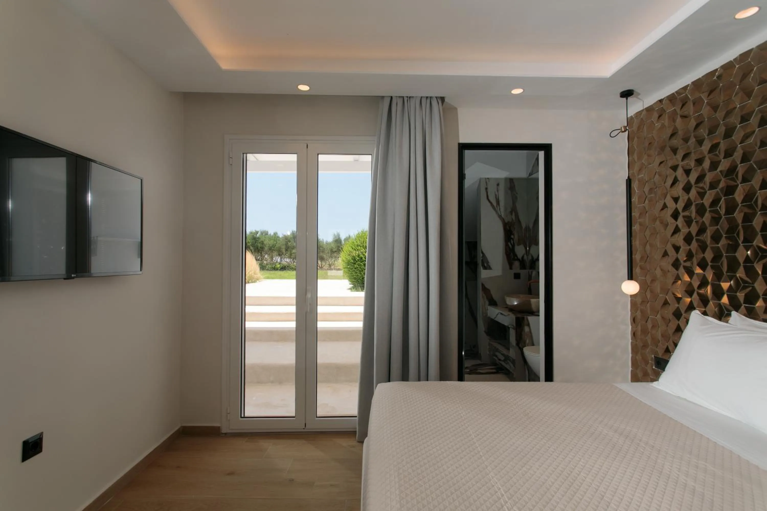 Bed in Iphimedeia Luxury Hotel & Suites